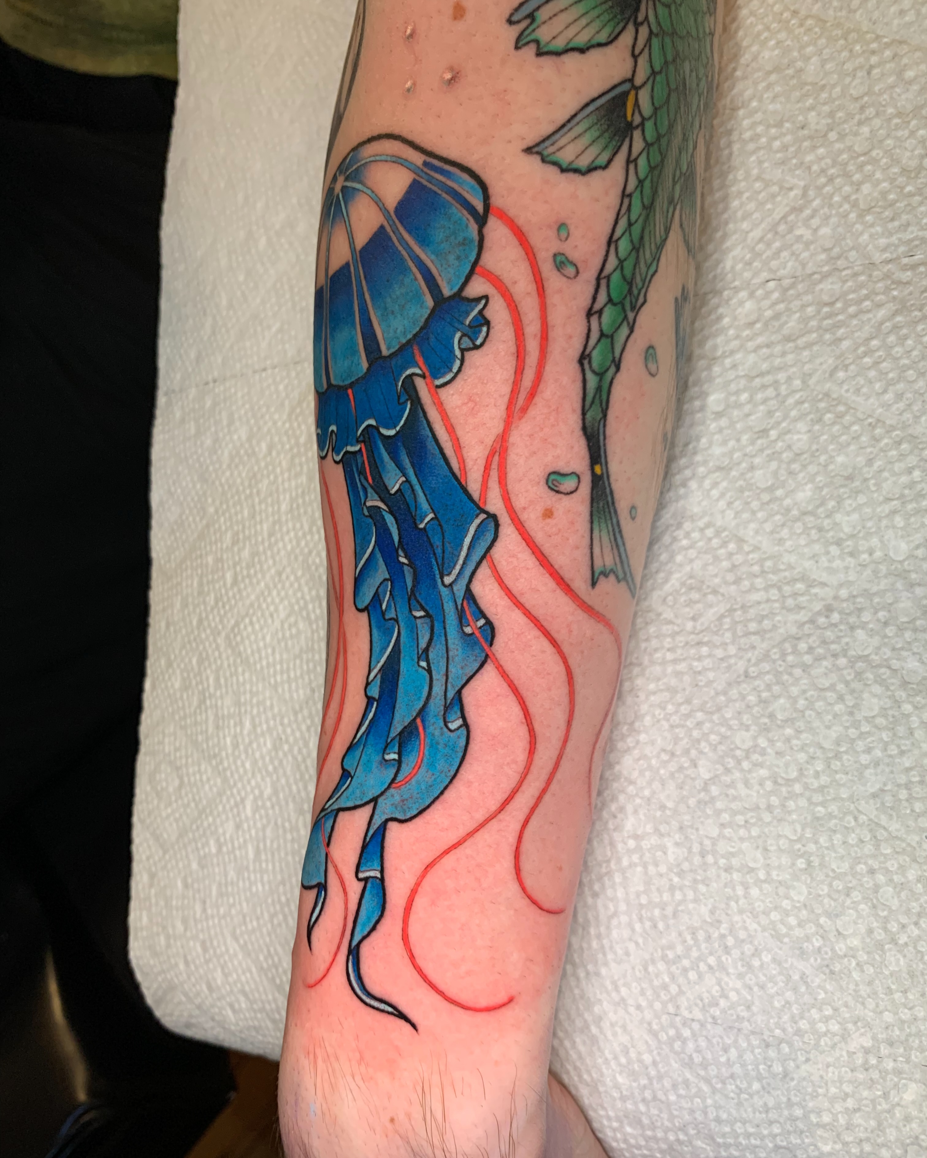 Jellyfish new school tattoo on the forearm by Mike G.