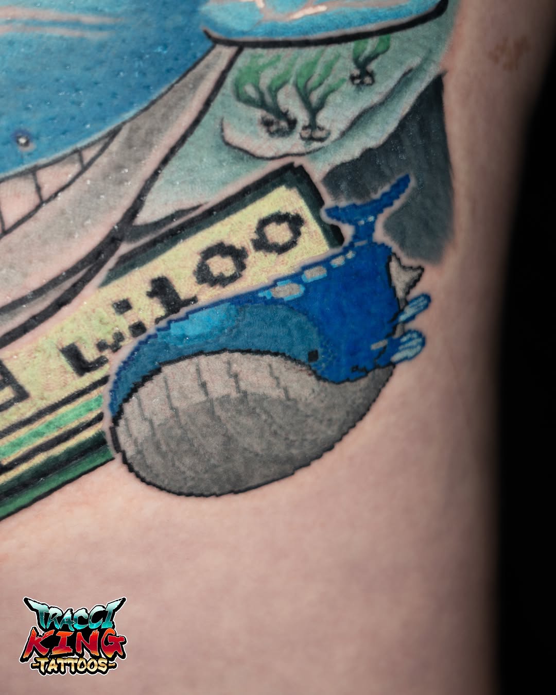 Blue fish realism tattoo on the forearm by Tracci King
