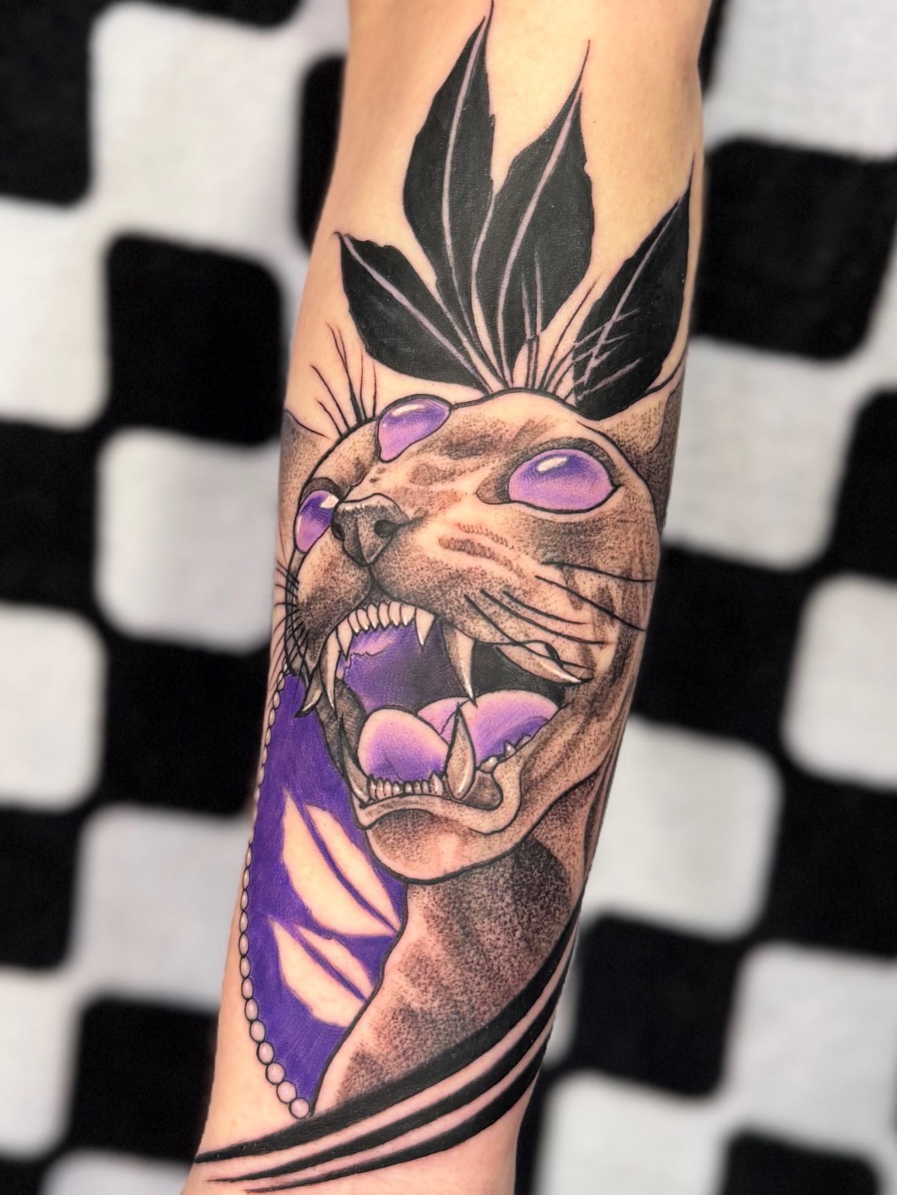 Cat realism tattoo on the forearm by Justin Hay