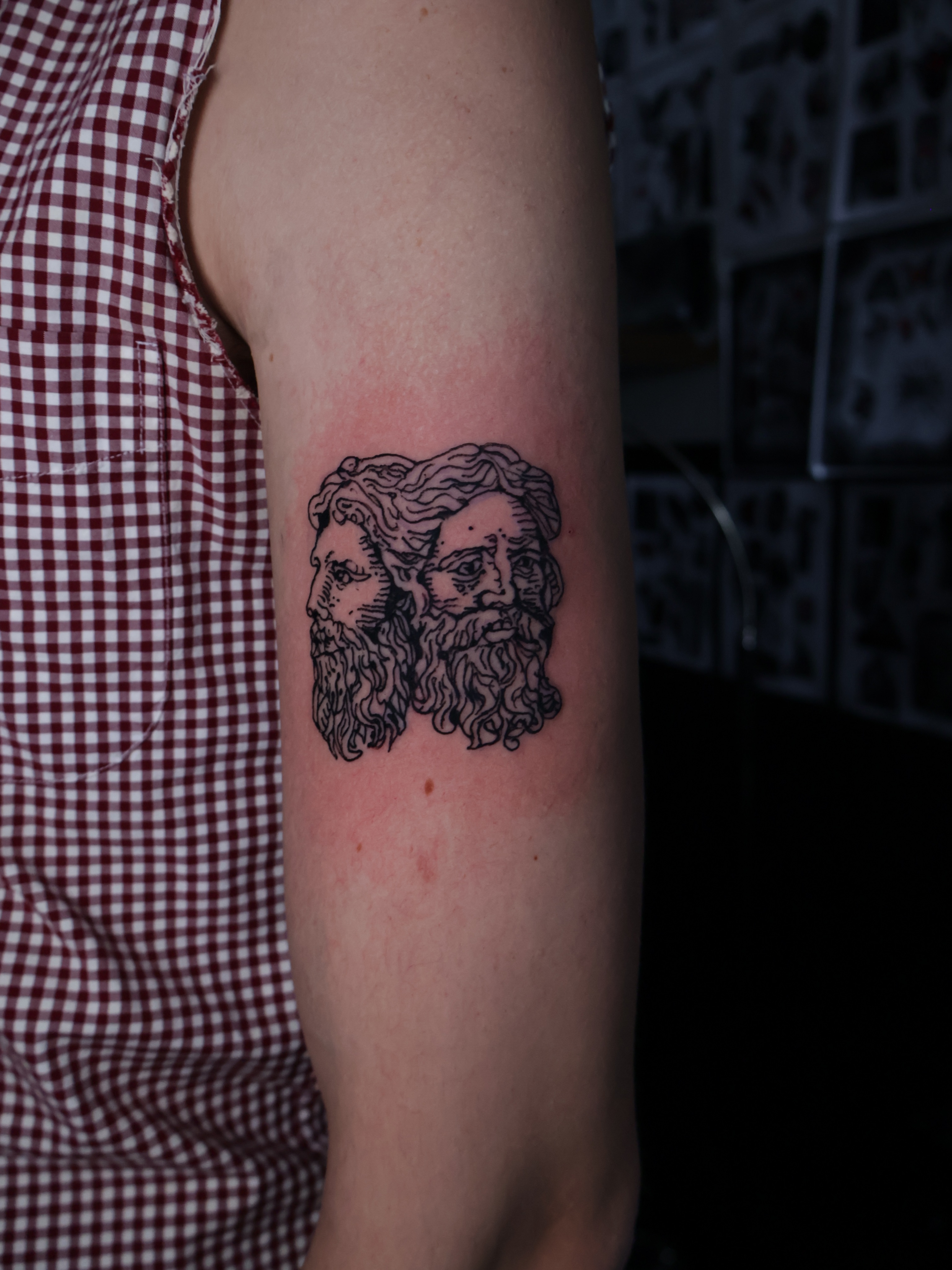 Bearded faces black and grey tattoo on the forearm by Denis Du Preez, East Williamsburg, Brooklyn