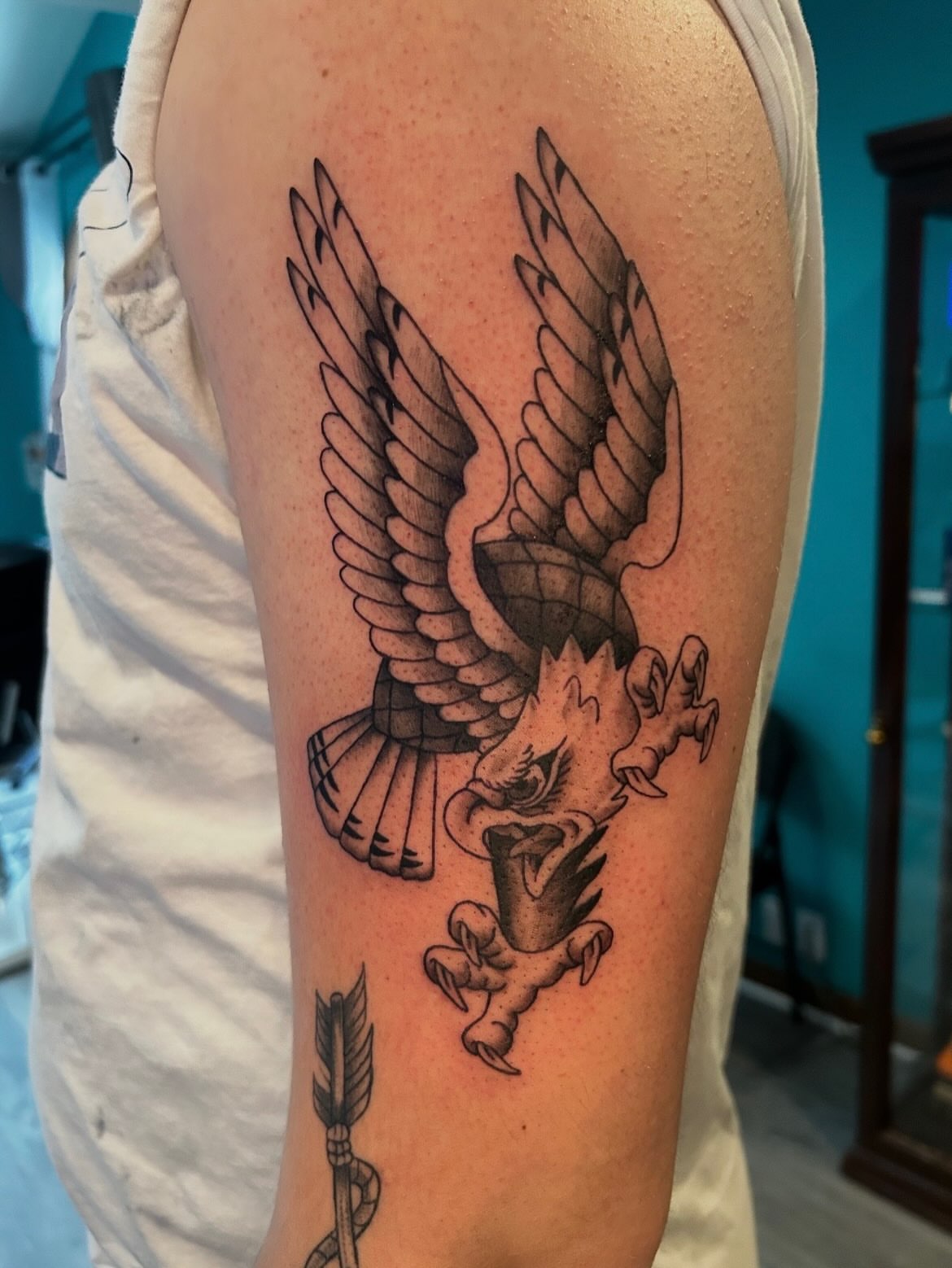 Eagle and dragon American traditional tattoo on the forearm by Tattoos by Fesik LLC