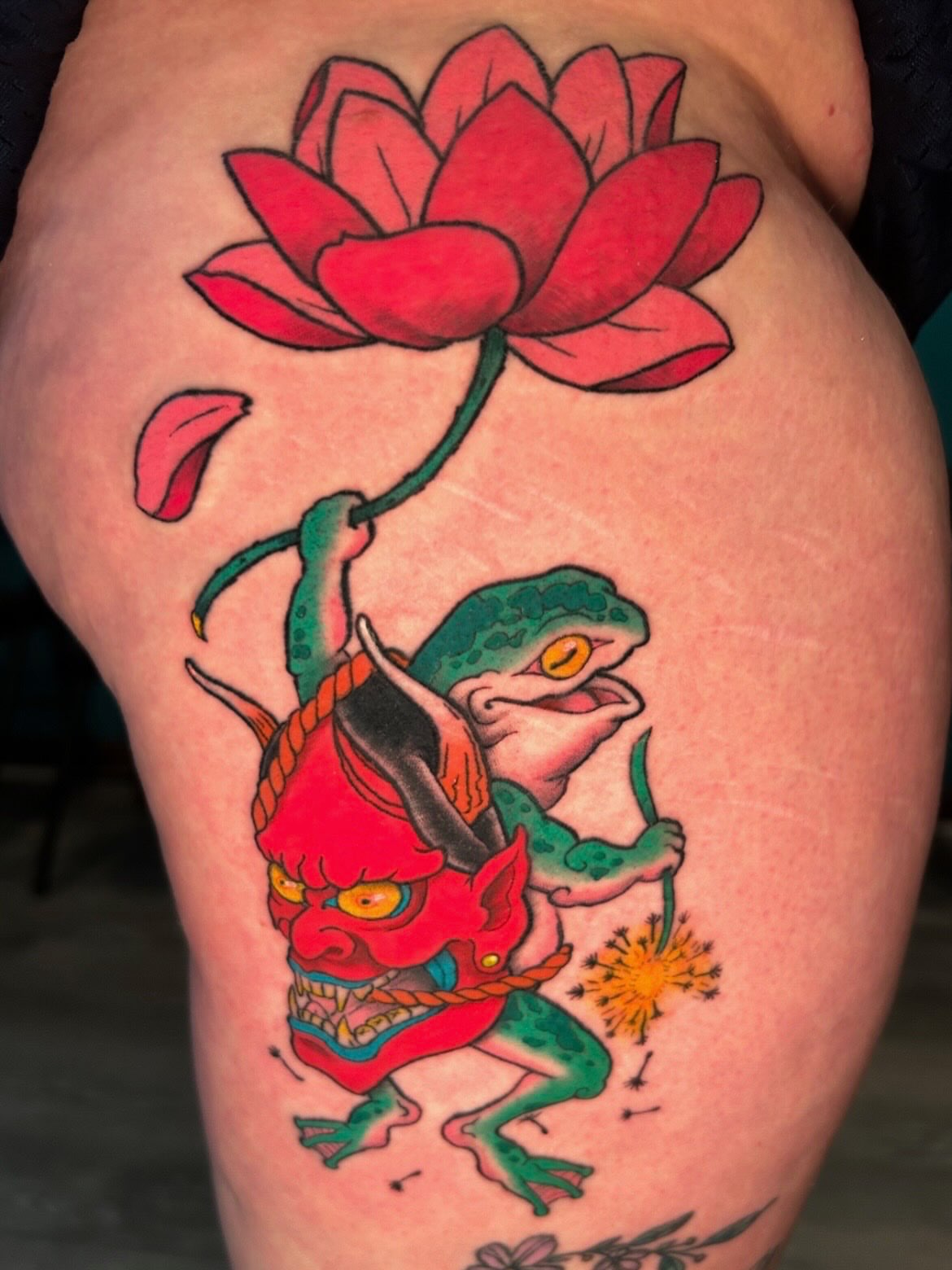 Frog and demon American traditional tattoo on the thigh by Tattoos by Fesik LLC