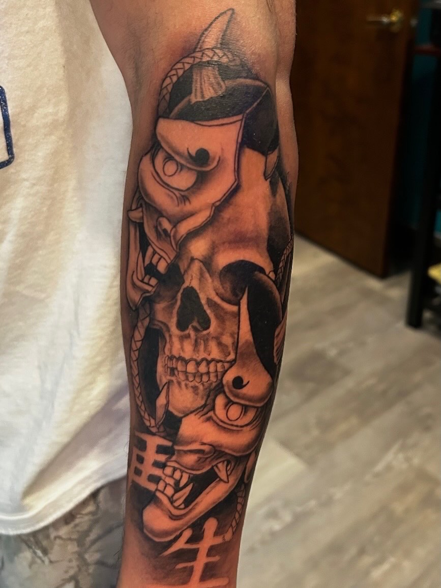 Skull and fish realism tattoo on the forearm by Tattoos by Fesik LLC