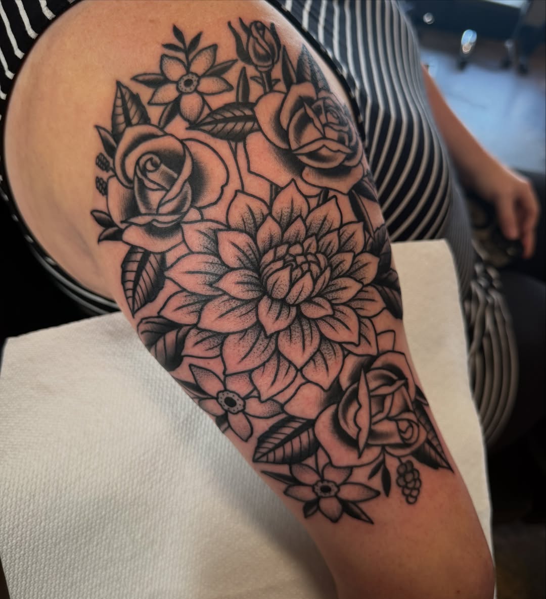 Floral bouquet black and grey tattoo on the forearm by Christopher Mikesell