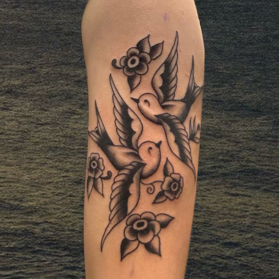 Swallow and flowers American traditional tattoo on the forearm by ★ eliza rodriguez🇲🇽 ★