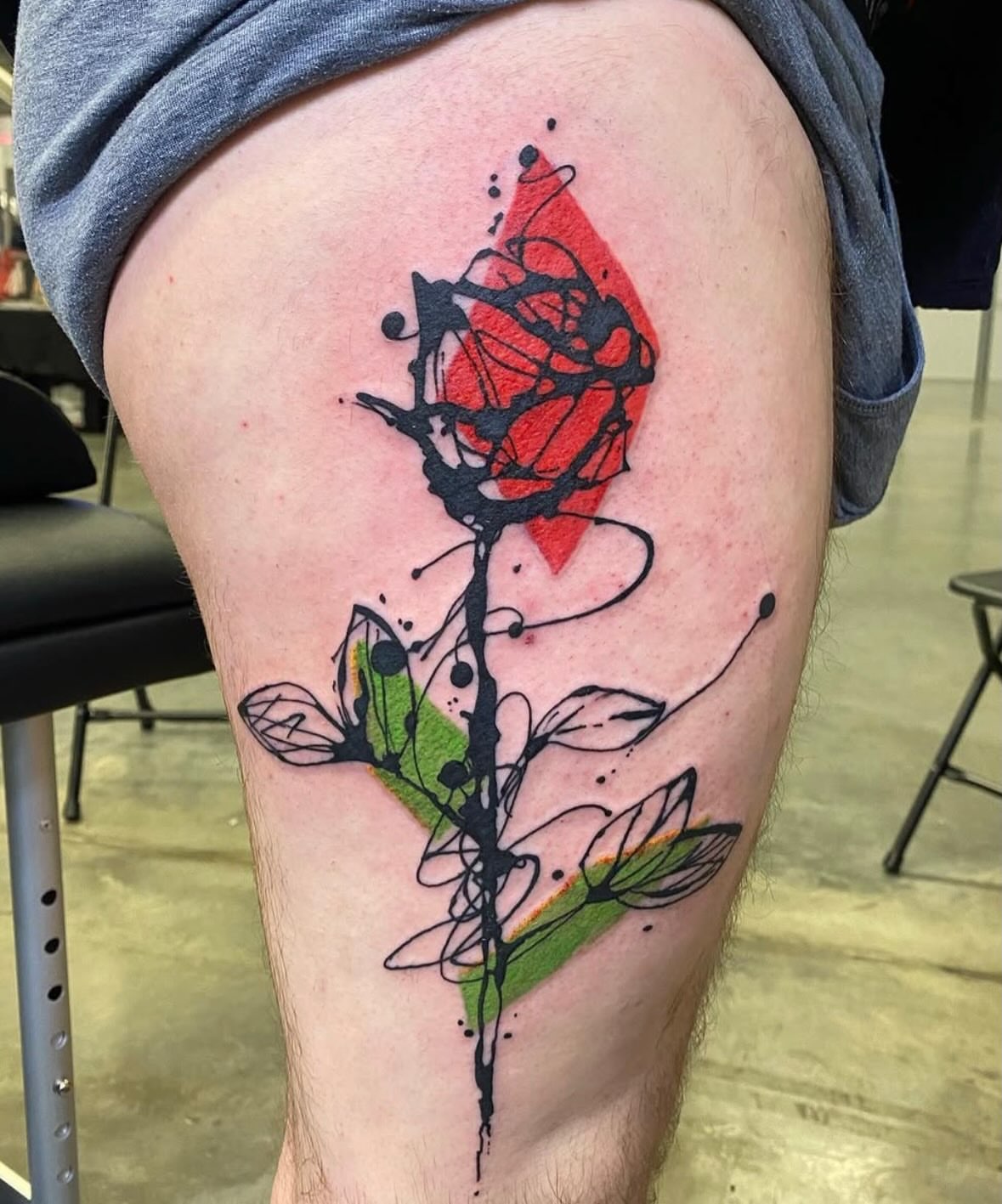 Abstract rose dotwork tattoo on the thigh by Keith Cromie