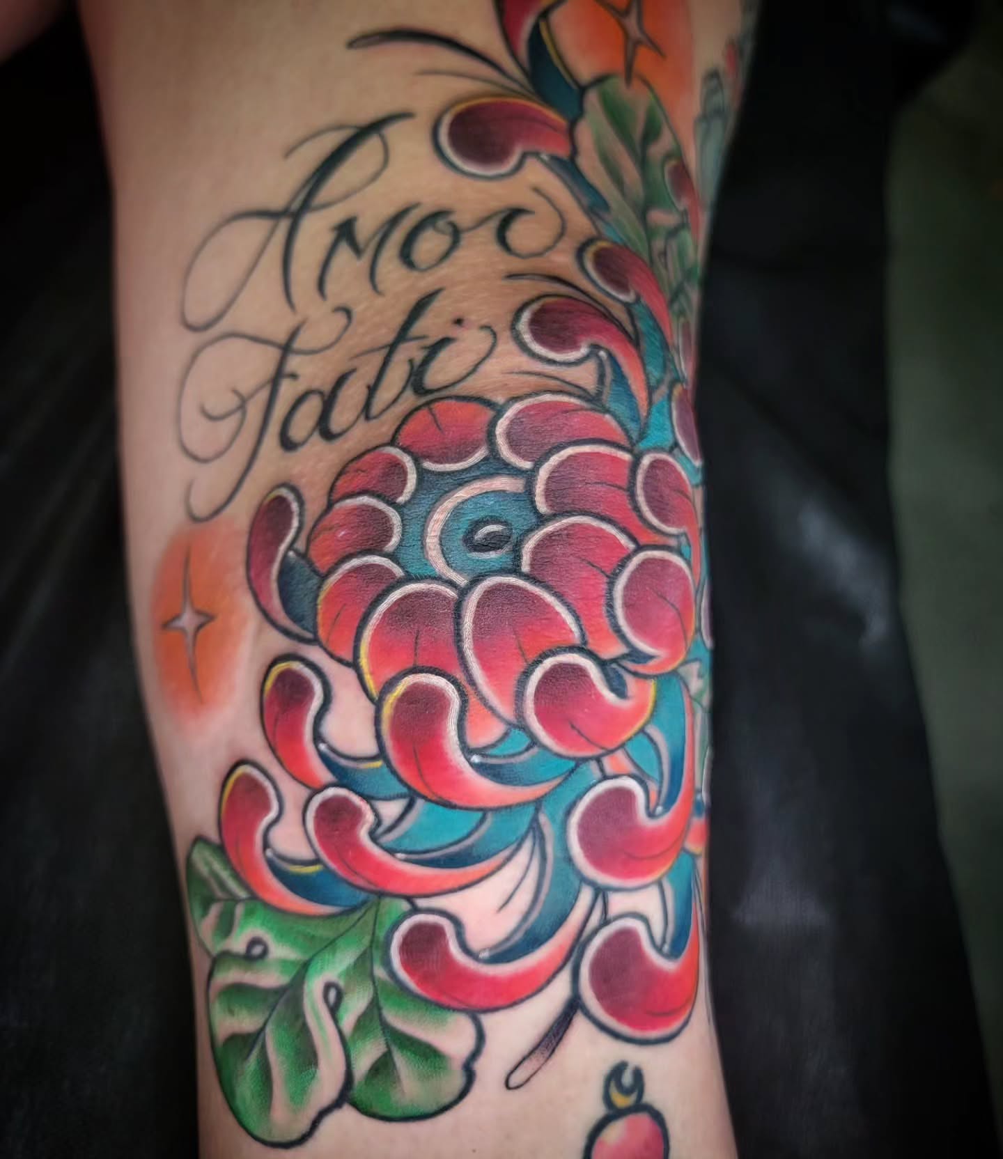 Chrysanthemum American traditional tattoo on the forearm by Randyz Tattyz