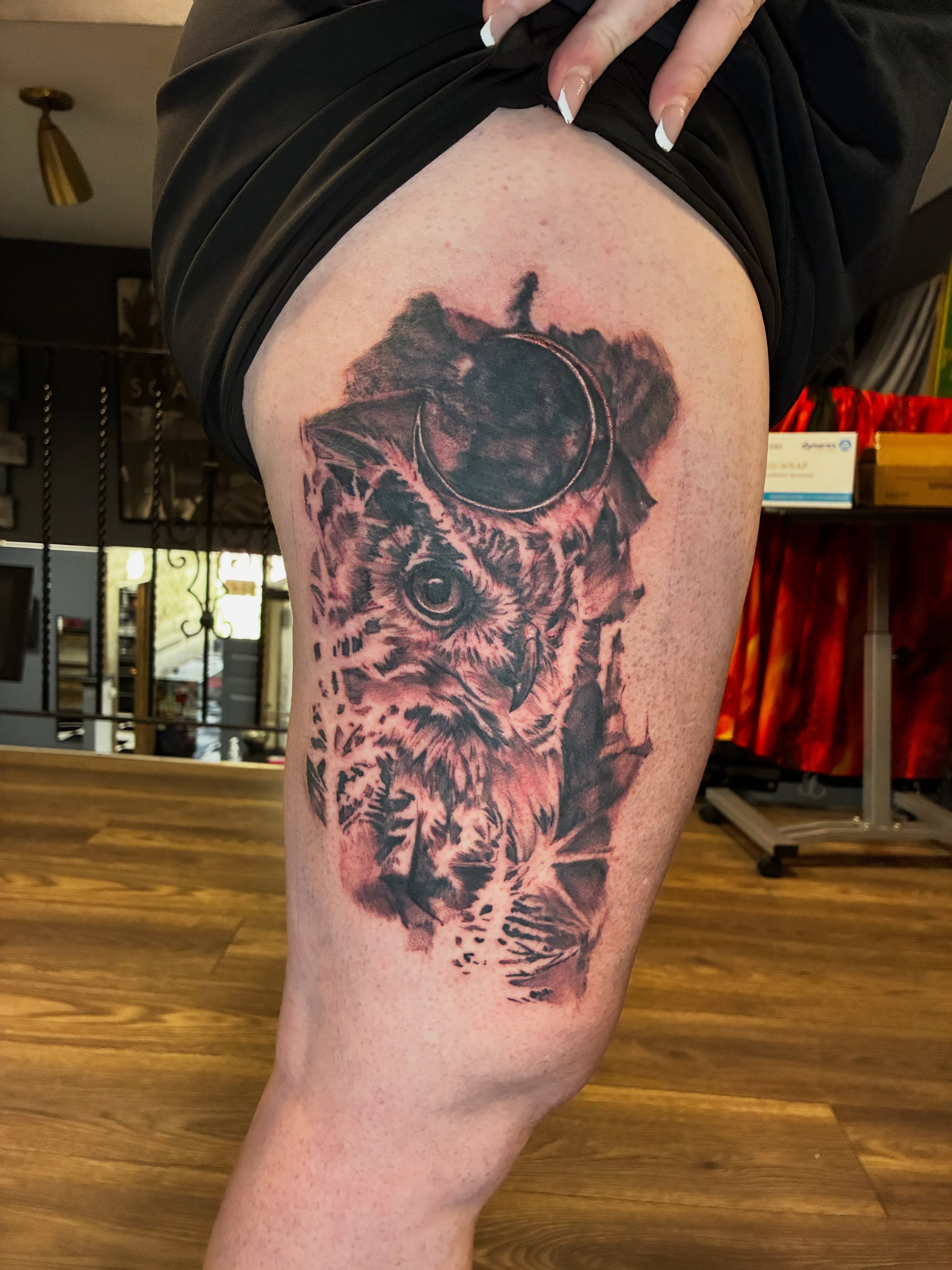 Owl realism tattoo on the thigh by Kevin Strong