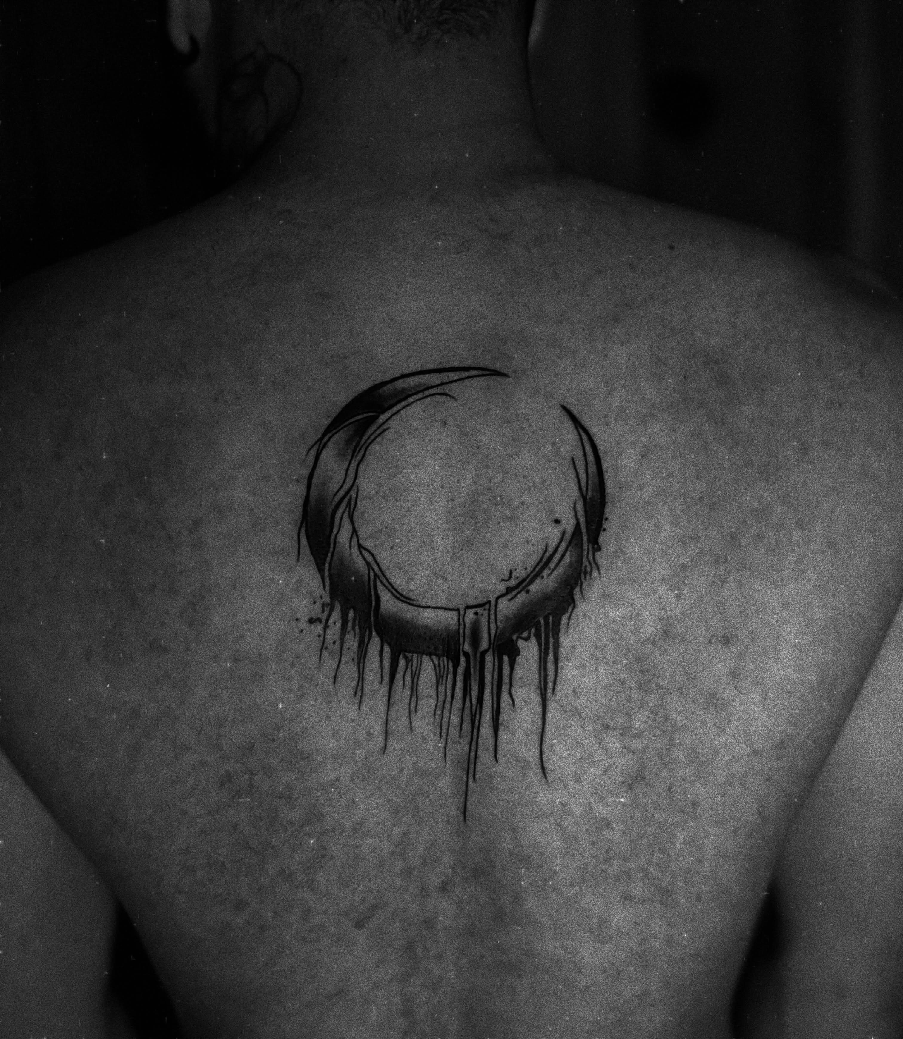 Moon black and grey tattoo on the back by Messias Tattoo Artist