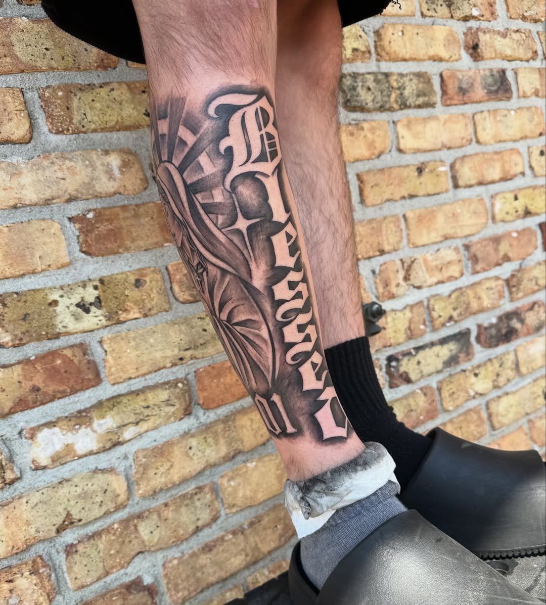 Lettering black and grey tattoo on the forearm by GrindHard Quen