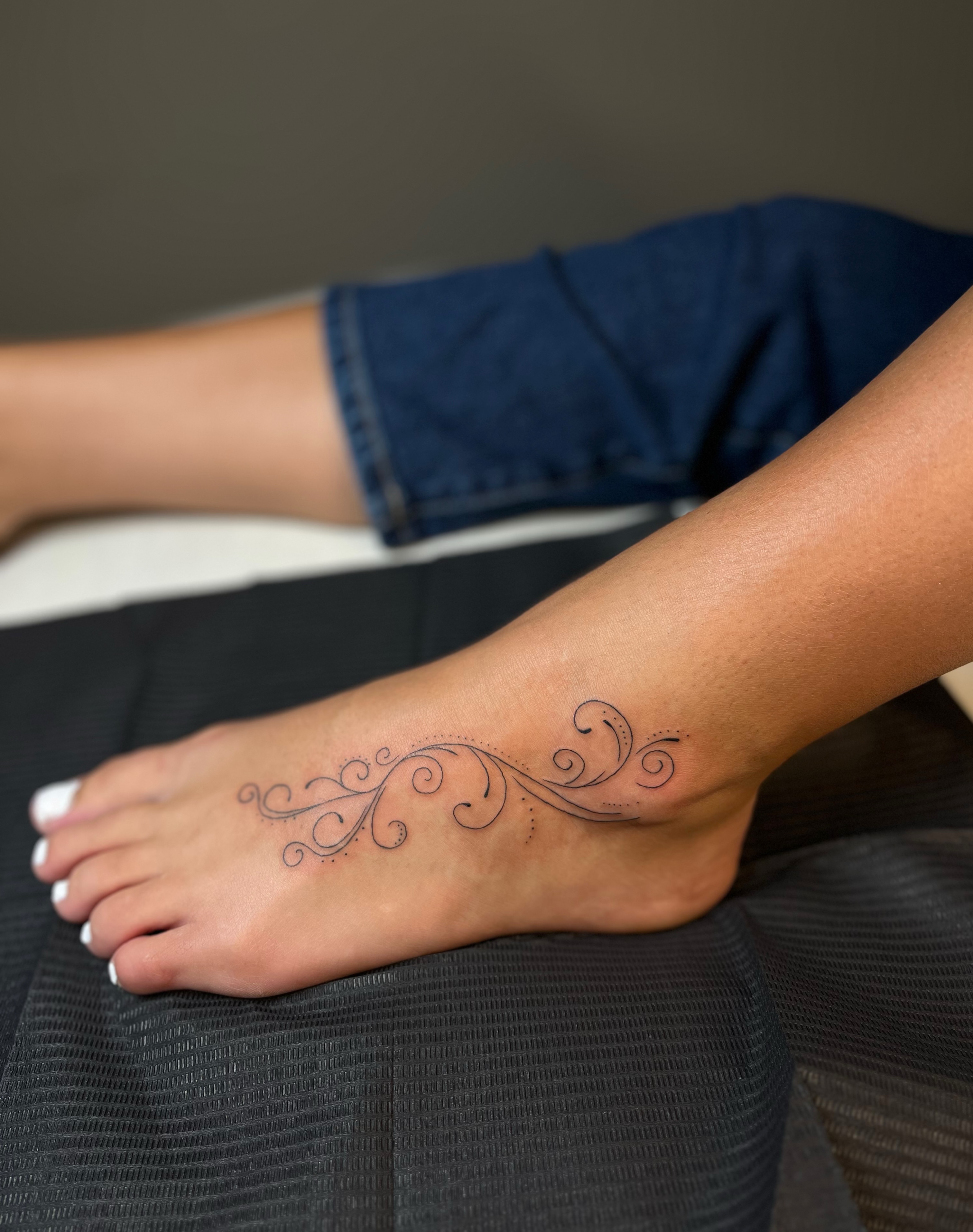 Swirls fine line tattoo on the foot by brinley - fine line tattoos, Crescent Springs, Kentucky