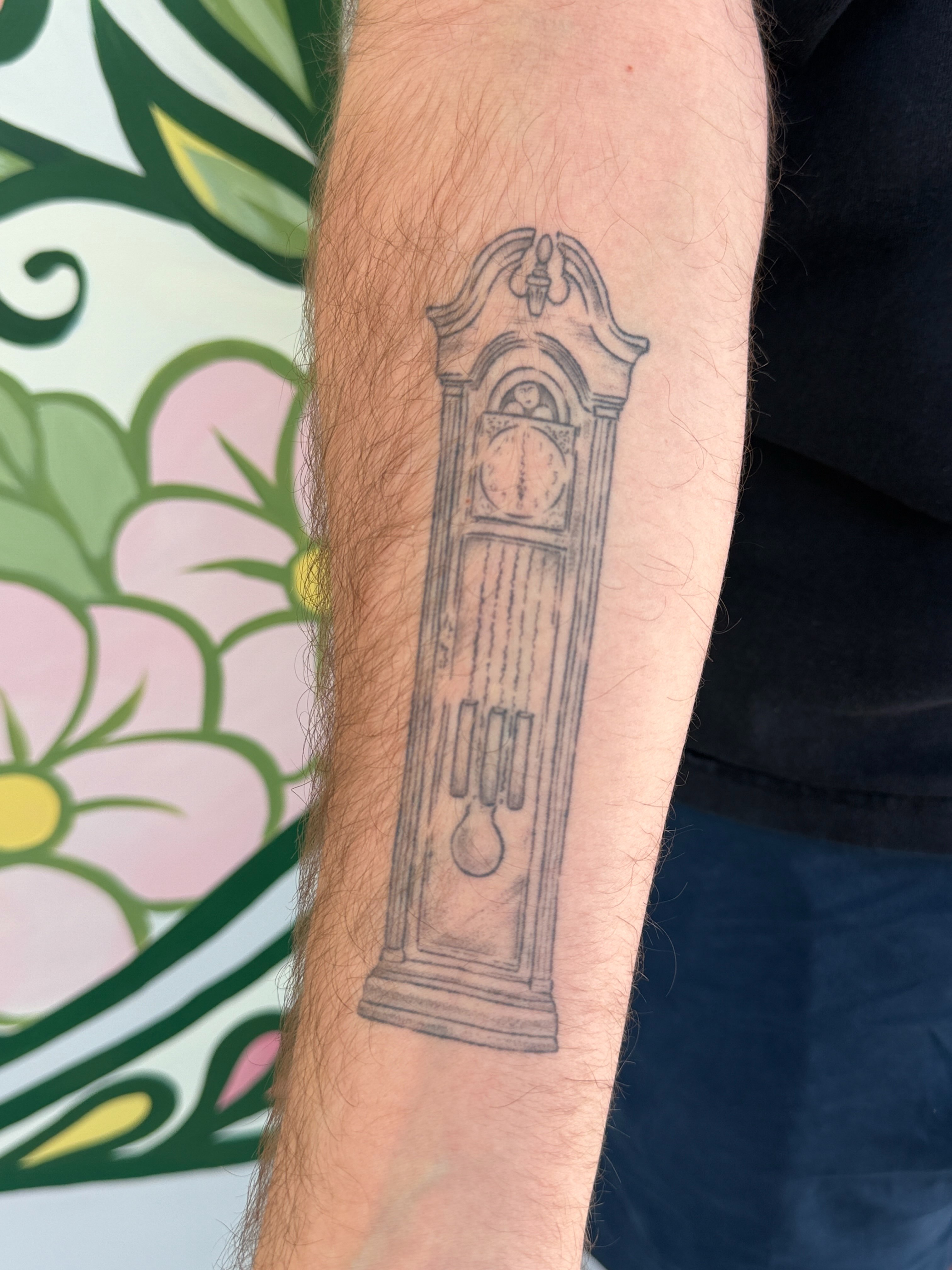 Grandfather clock black and grey tattoo on the forearm by gabrielle rosemary ποΈ