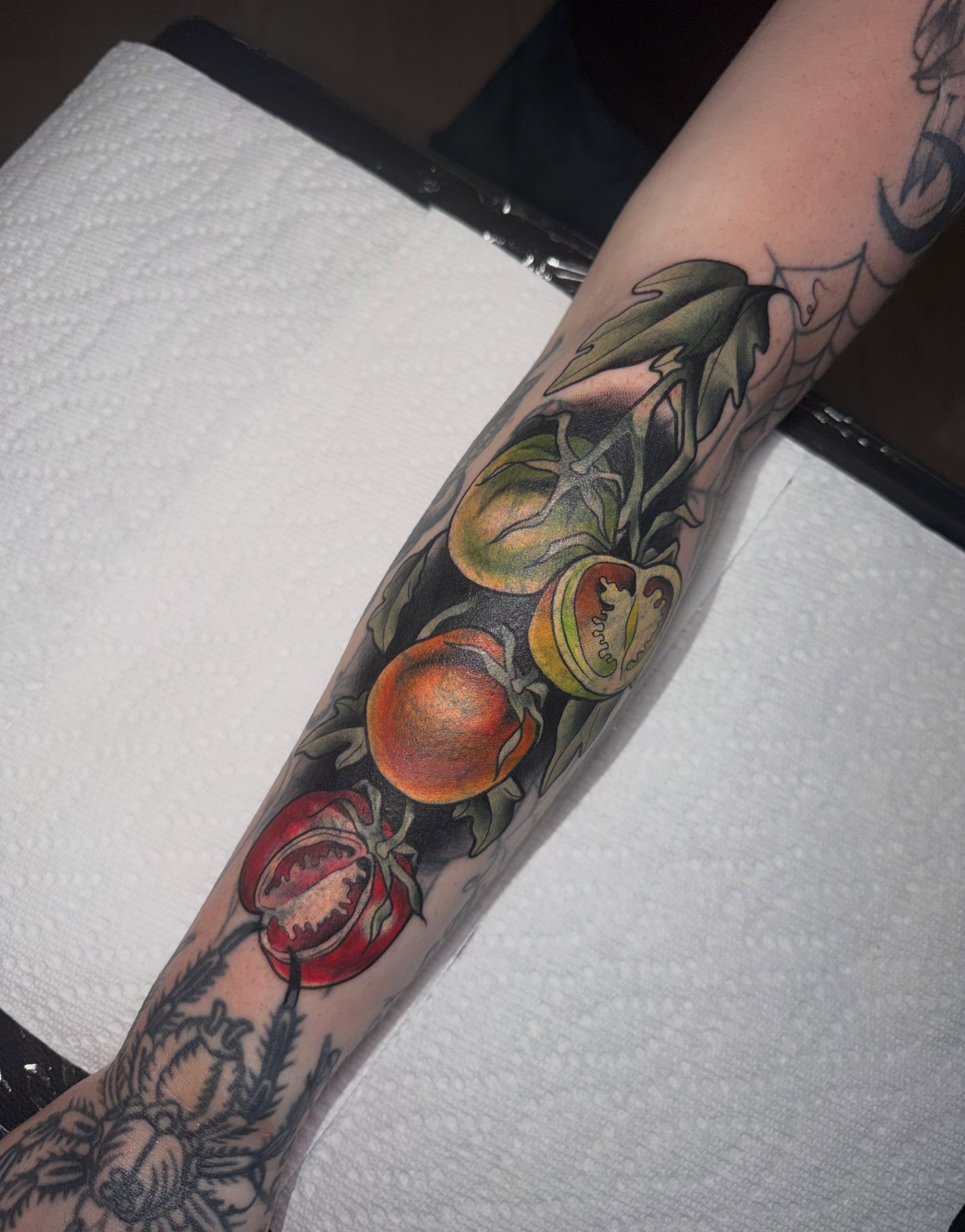 Fruit and leaves American traditional tattoo on the forearm by Lyndze Masters