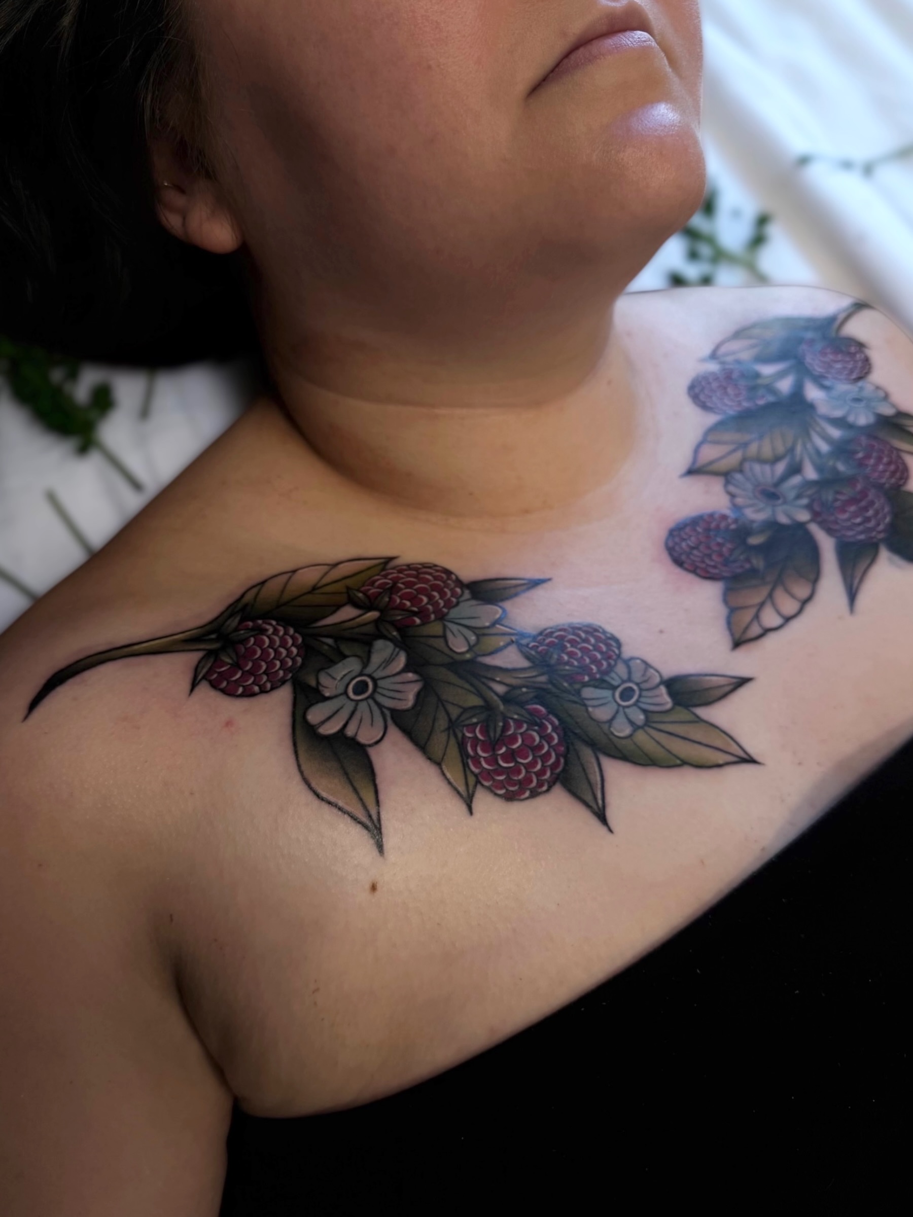 Raspberry branch American traditional tattoo on the shoulder by Daphne Love