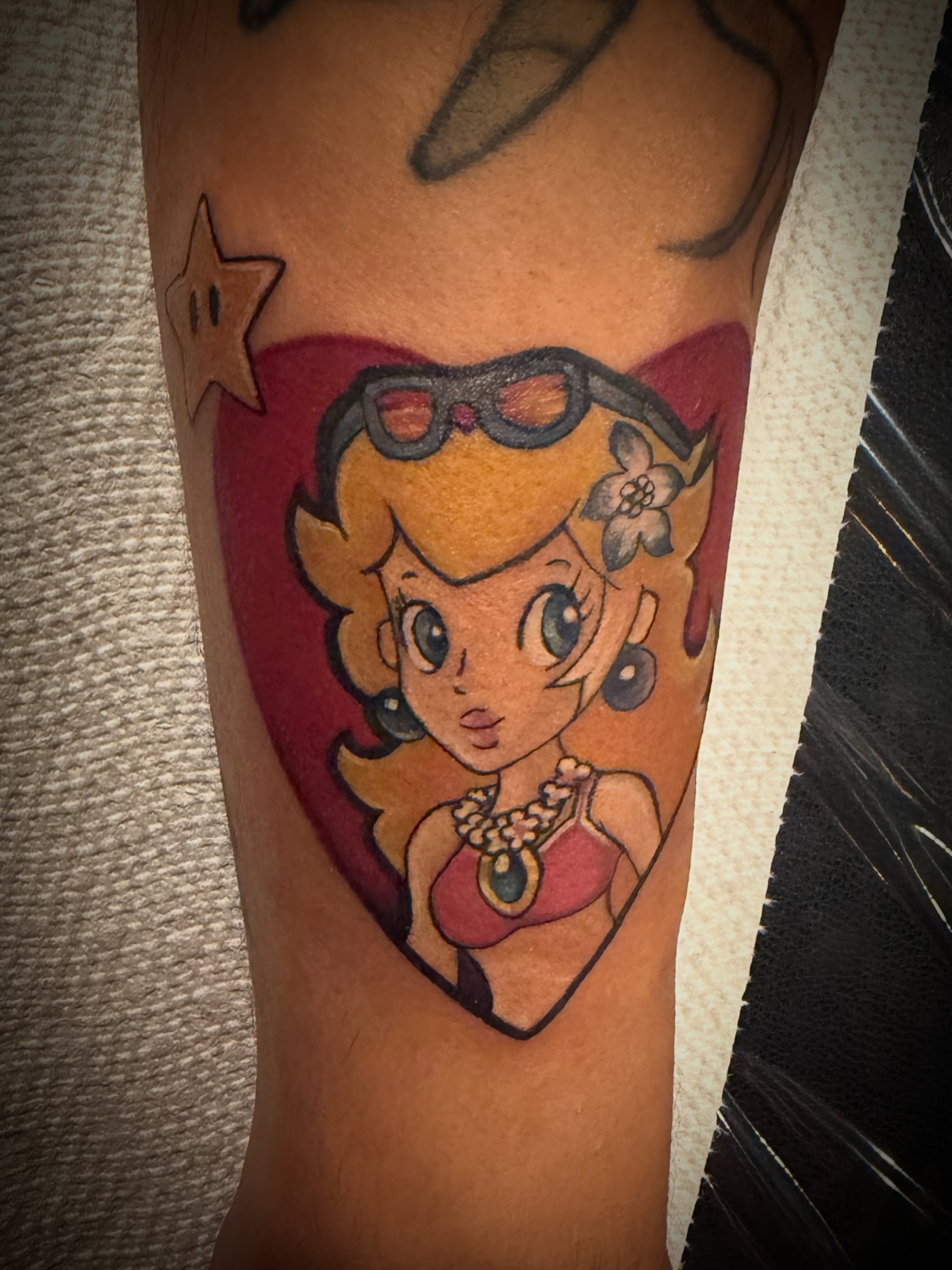 Super mario princess anime tattoo on the forearm by Shae Sullivan