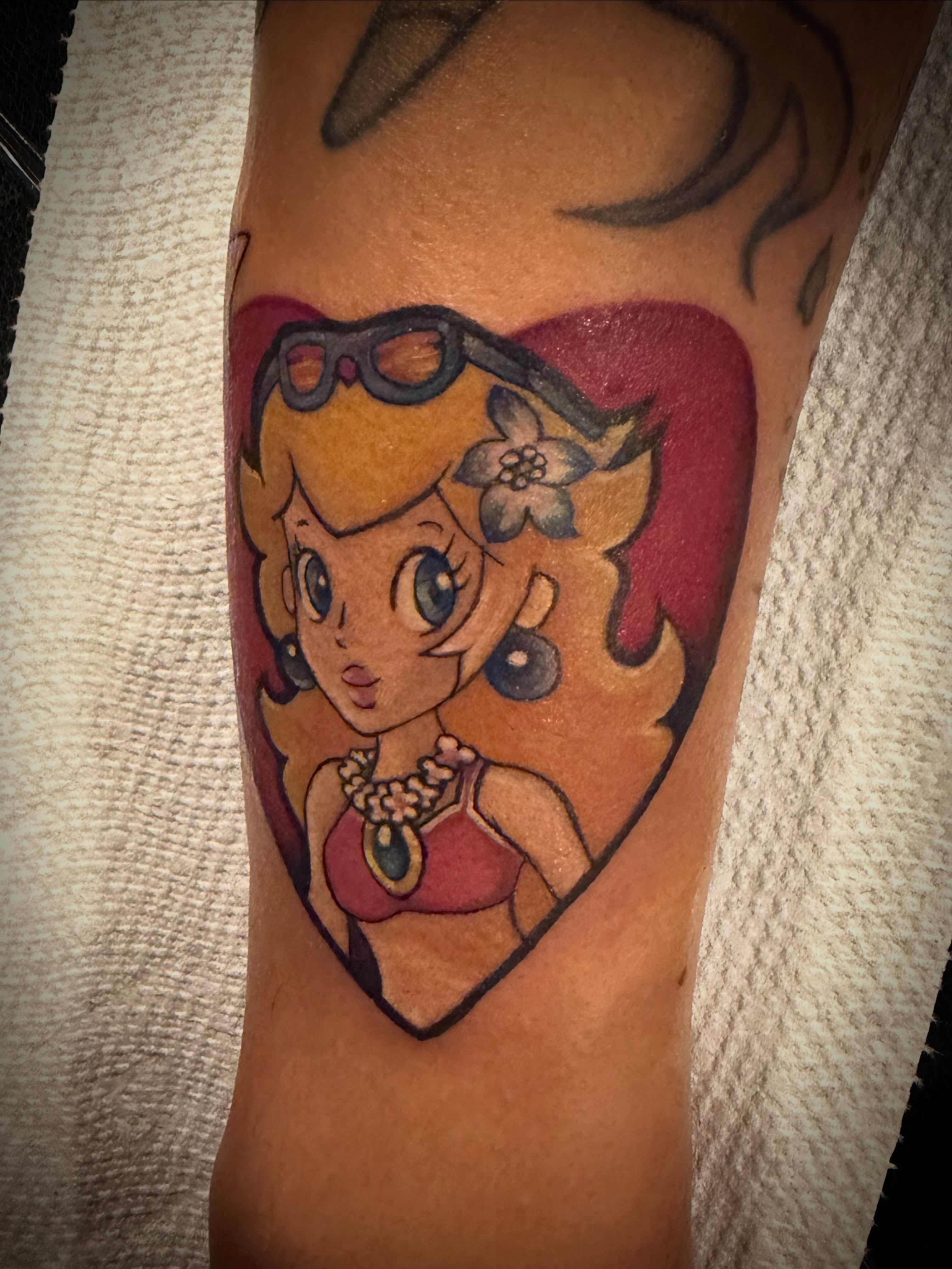 Princess peach anime tattoo on the forearm by Shae Sullivan