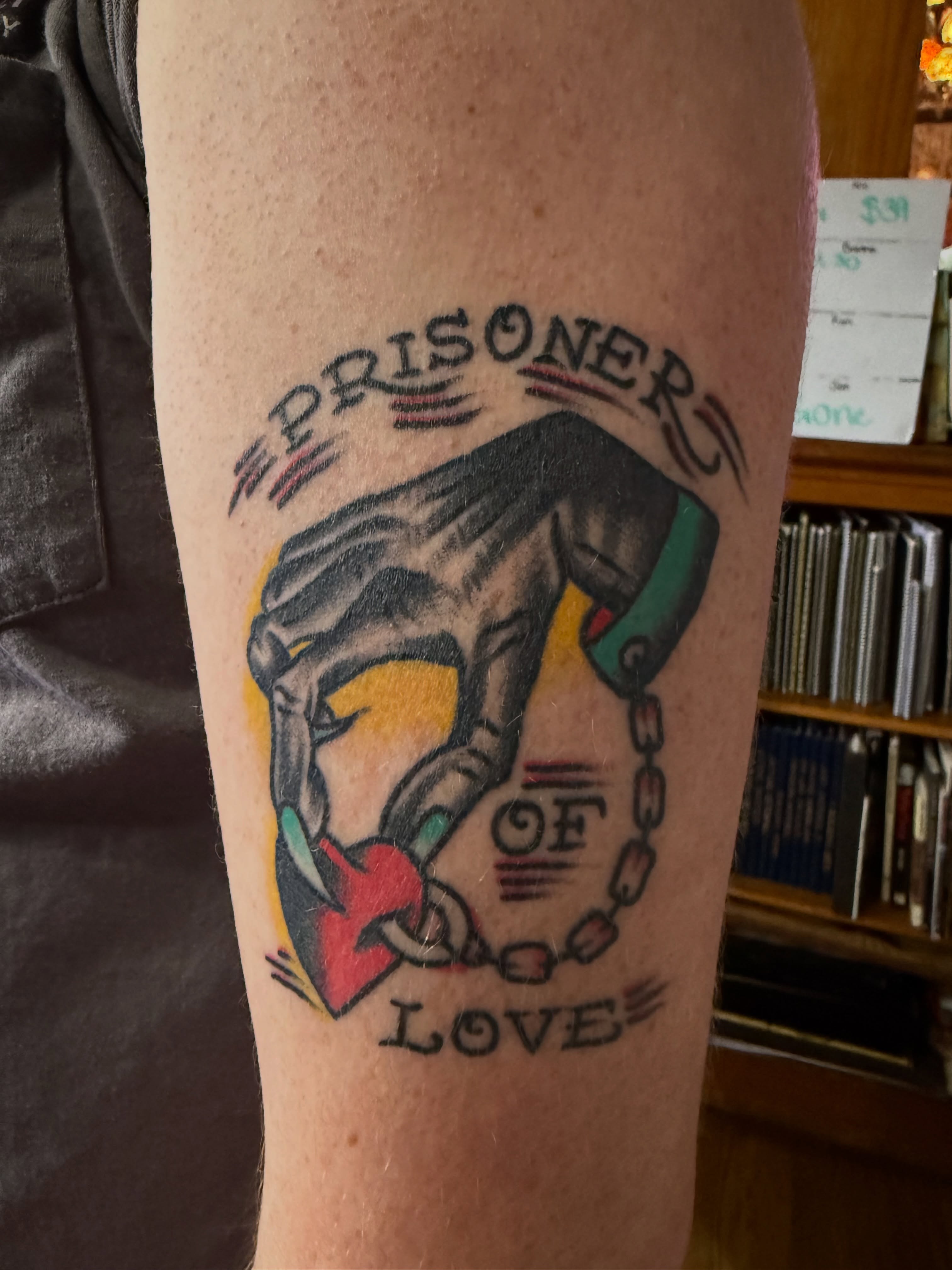 Prisoner of love American traditional tattoo on the forearm by Chuck Derek Whitaker