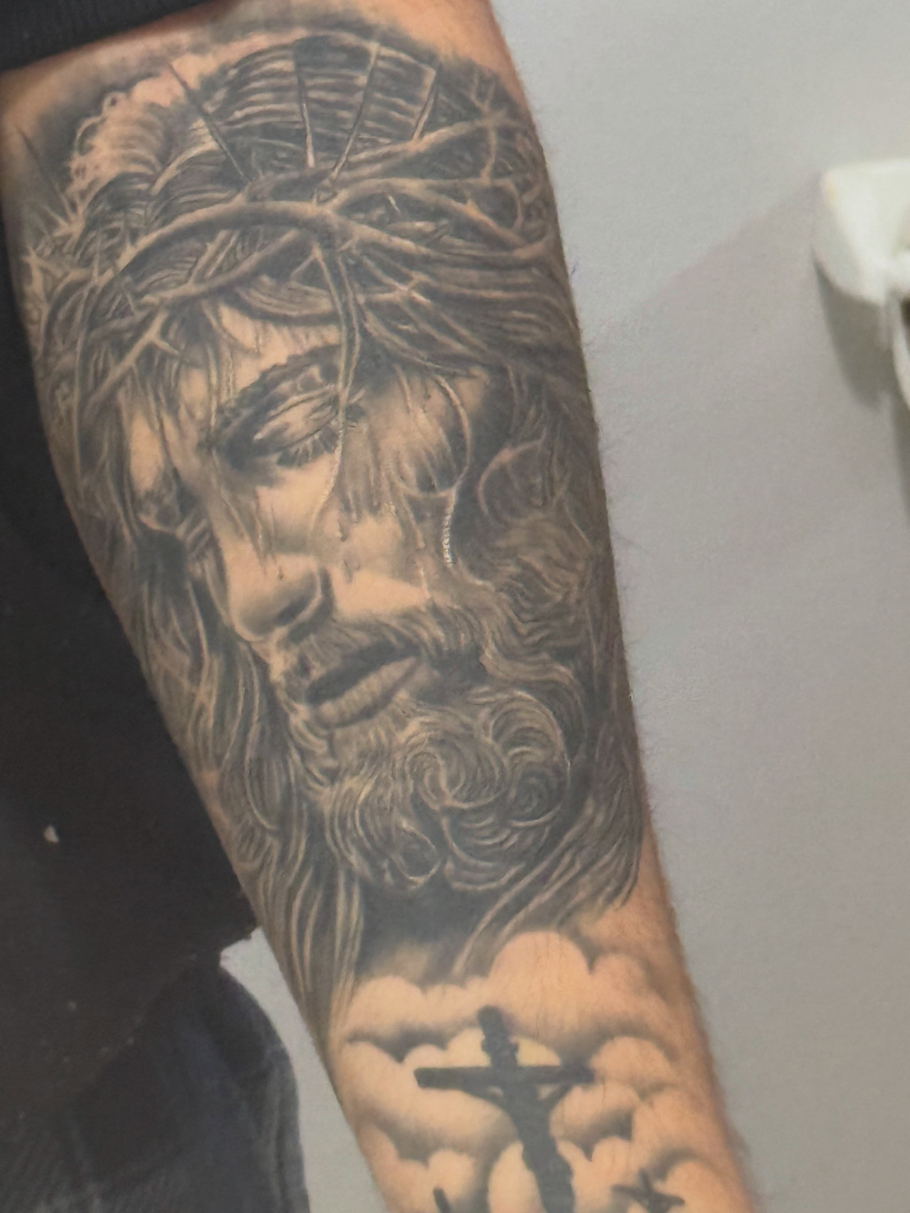 Jesus Christ realism tattoo on the forearm by Dany