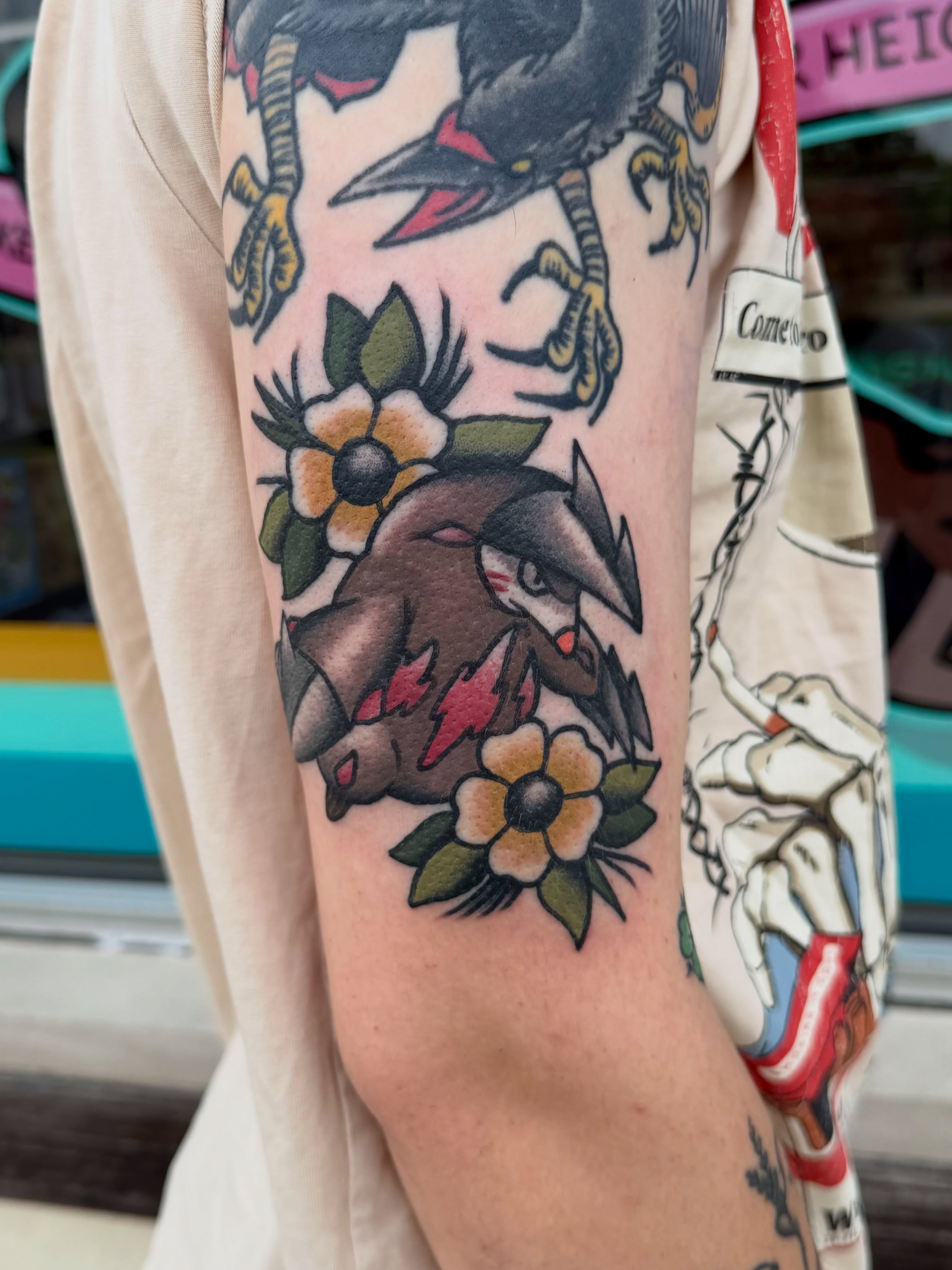 Crow and flowers American traditional tattoo on the forearm by Patrick Miller, Huber Heights, Ohio