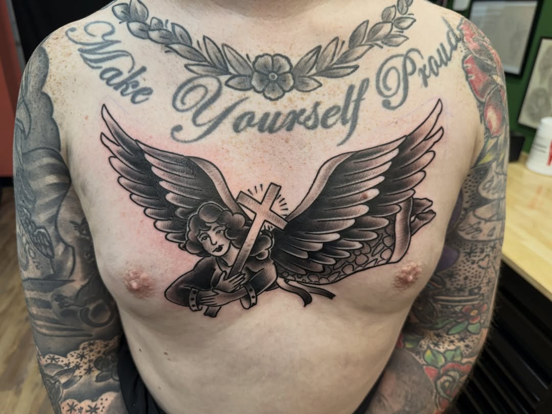 Angel with cross American traditional tattoo on the chest by Josh Roberts, Franklin, Ohio