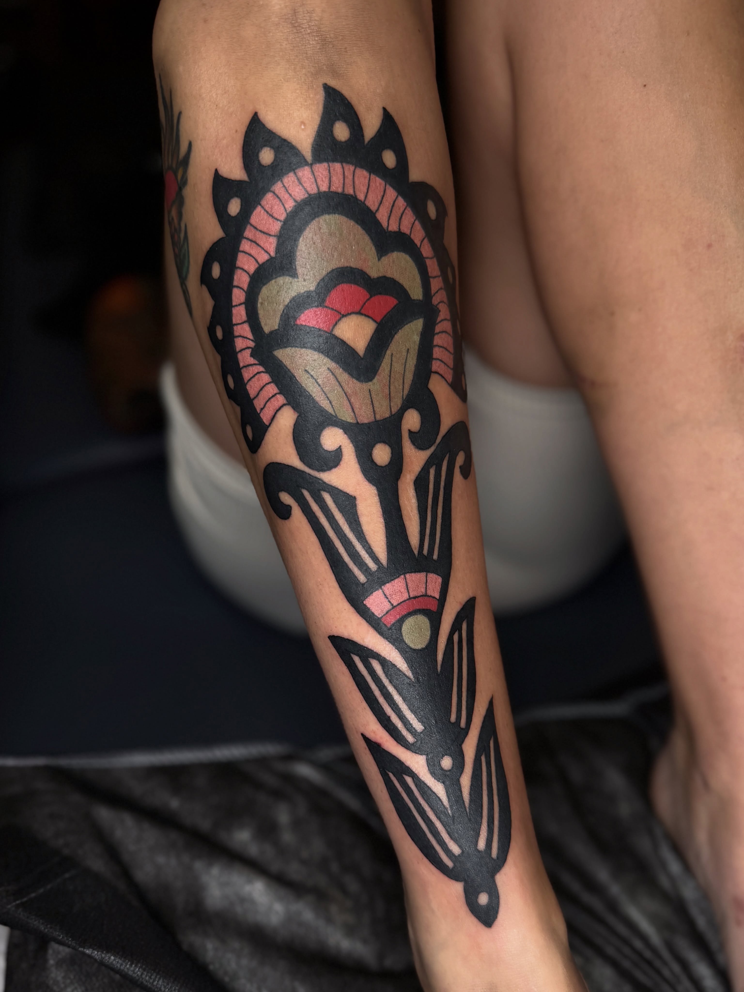 Abstract floral American traditional tattoo on the forearm by lily gustave i tattoo