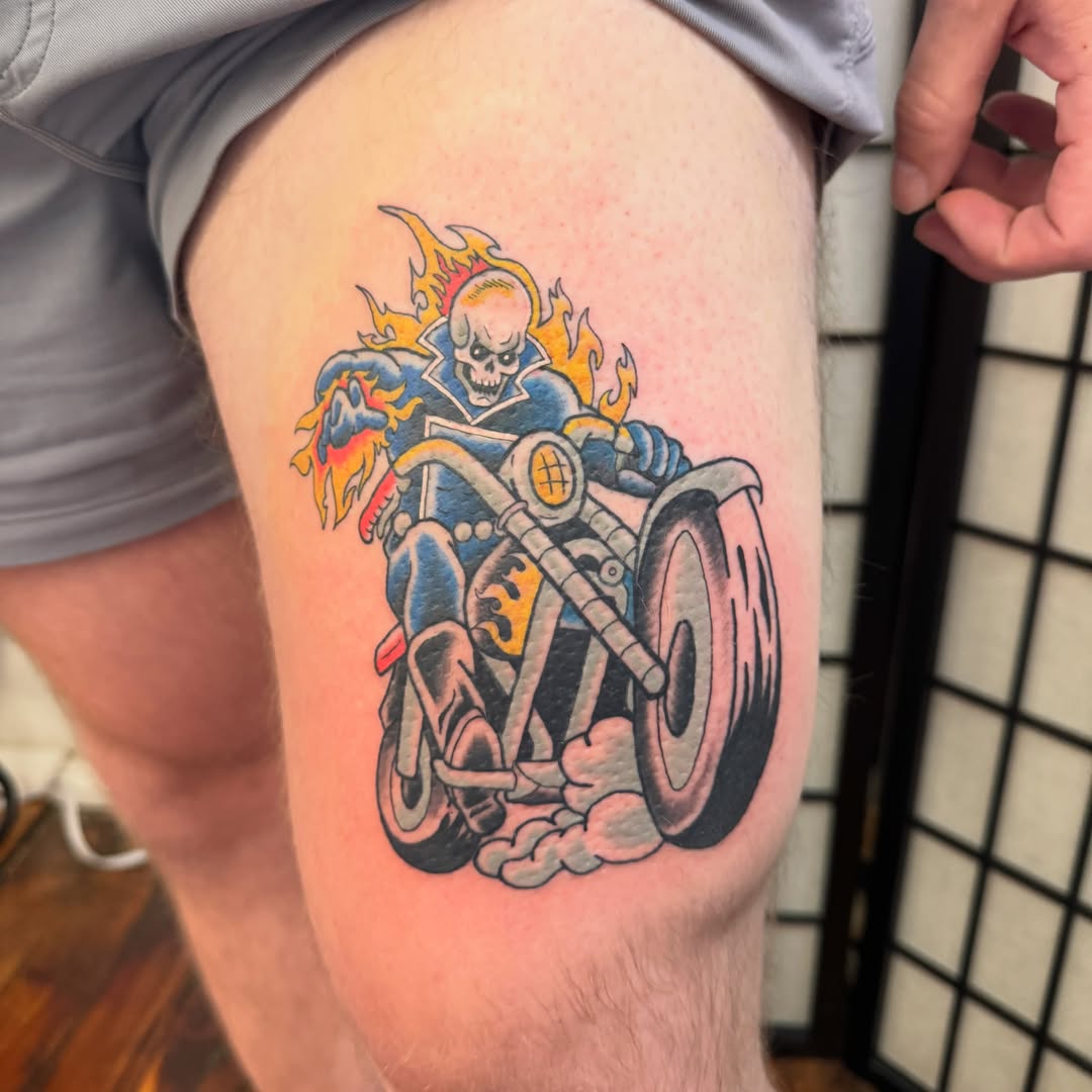 Motorcycle rider American traditional tattoo on the thigh by Zac Smith-Chevalier