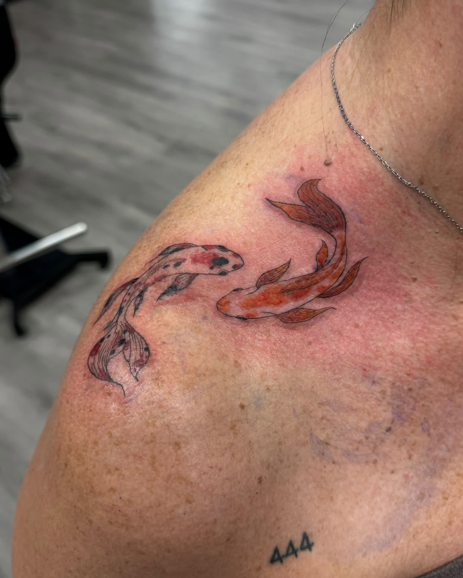 Koi fish dotwork tattoo on the shoulder by Israel Jacob Woehler