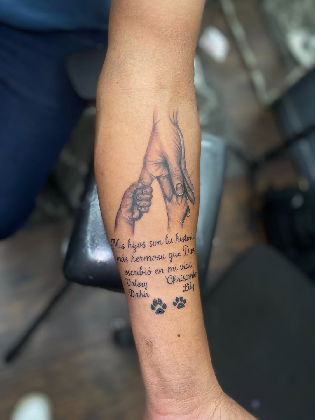 Hands and quote with paw prints tattoo on the forearm by Irving Guzman
