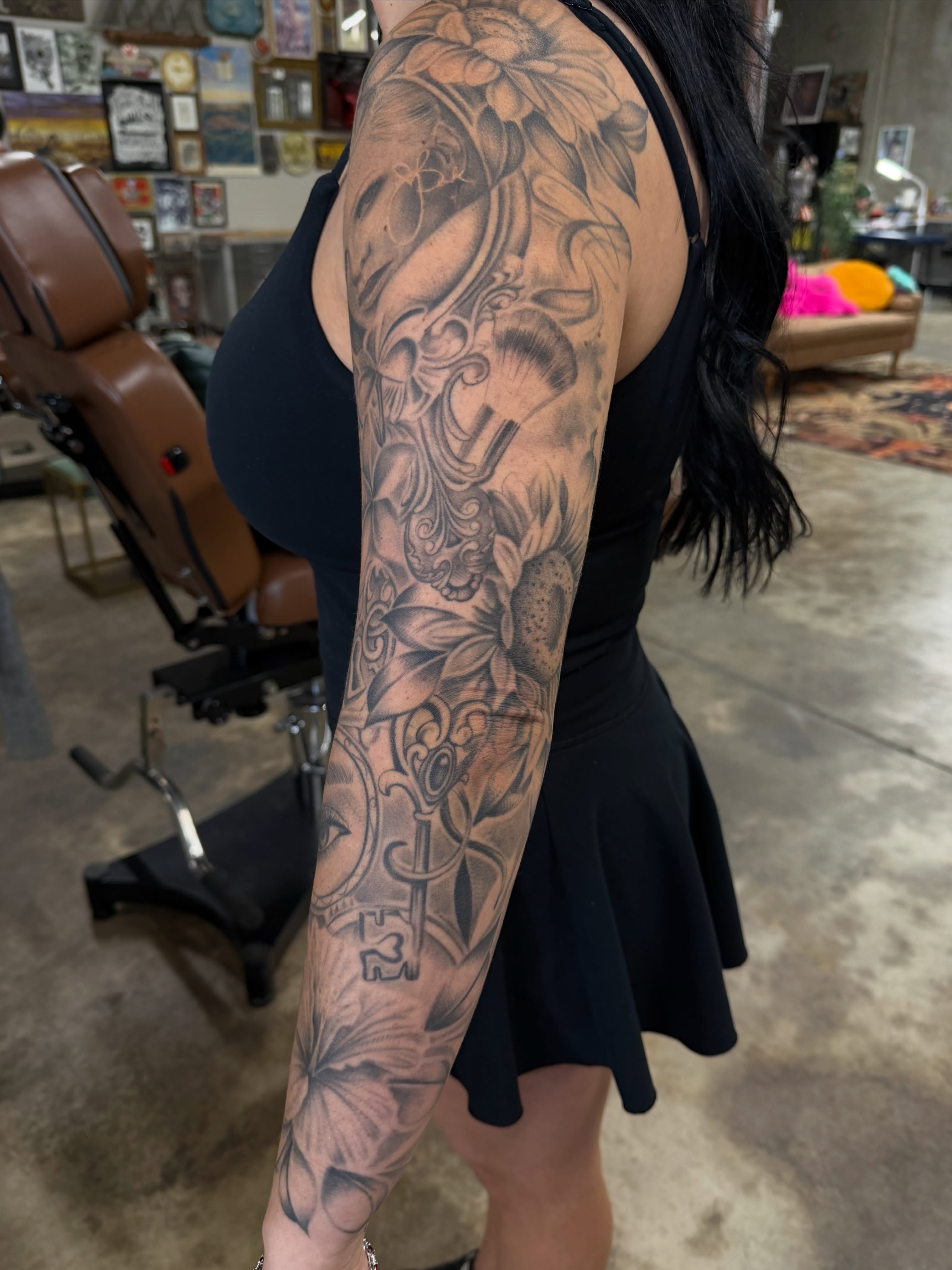 Floral and key realism tattoo on the forearm by ✨ Jaden Belle Tattoos ✨