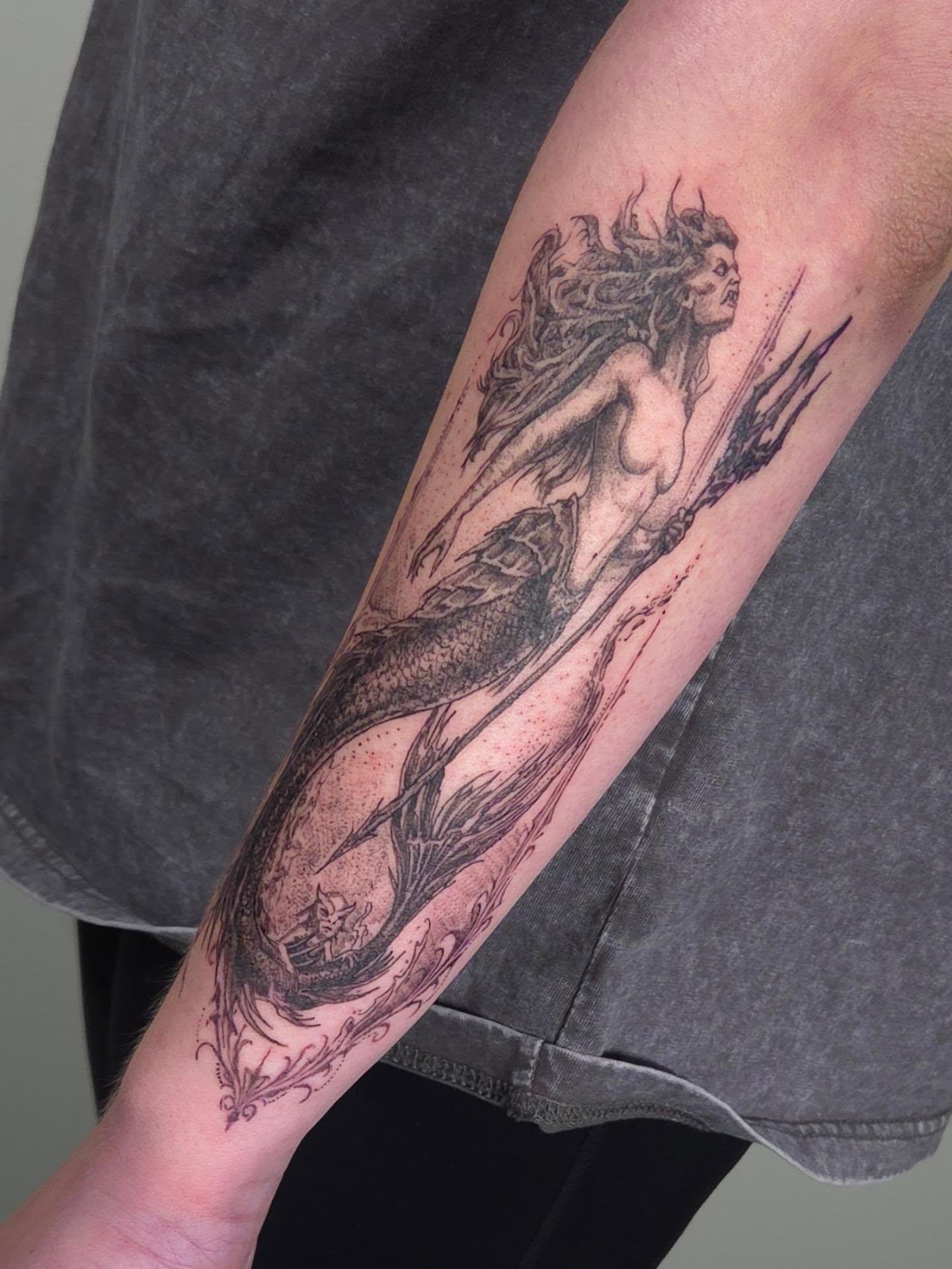 Mermaid realism tattoo on the forearm by ๐๐ฎ๐ป๐ฎ๐ถ๐, Charlotte, North Carolina
