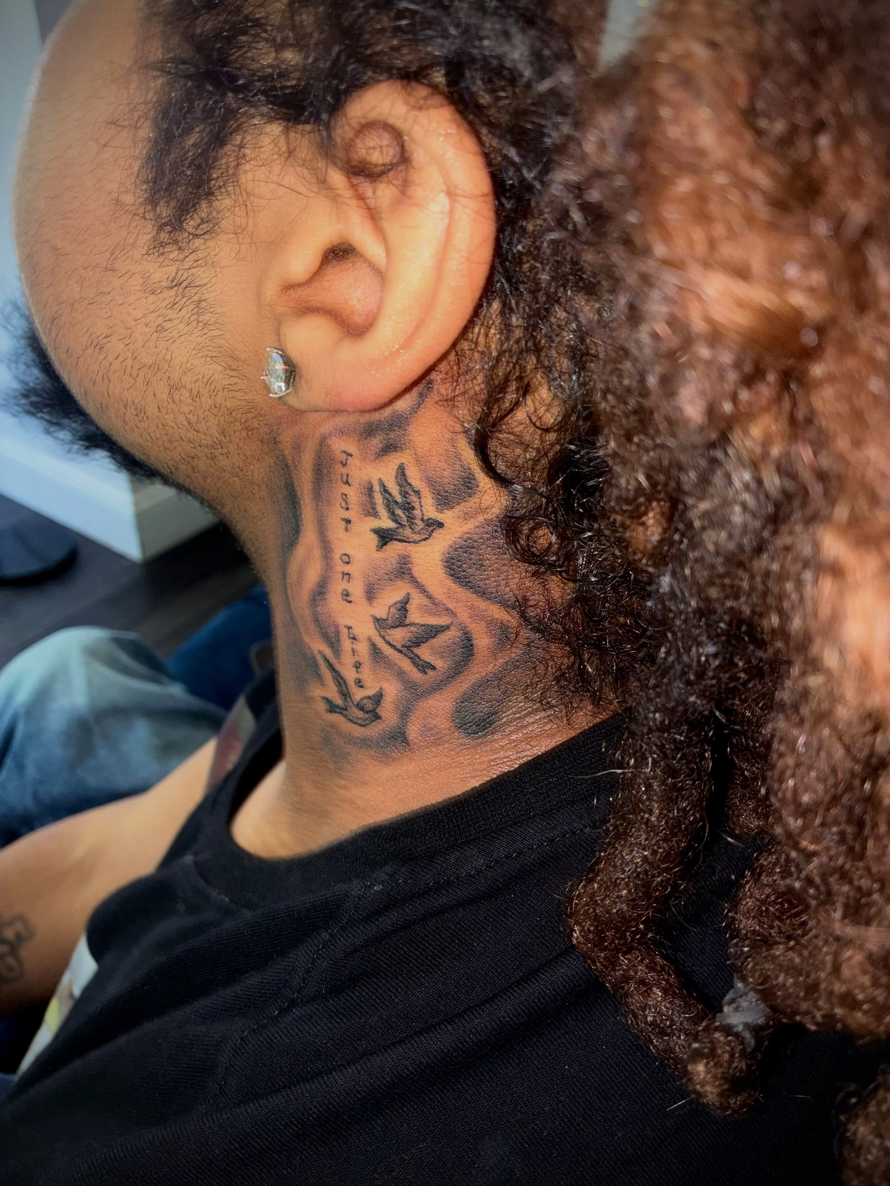 Birds black and grey tattoo on the neck by Sonya son tattoos and piercings