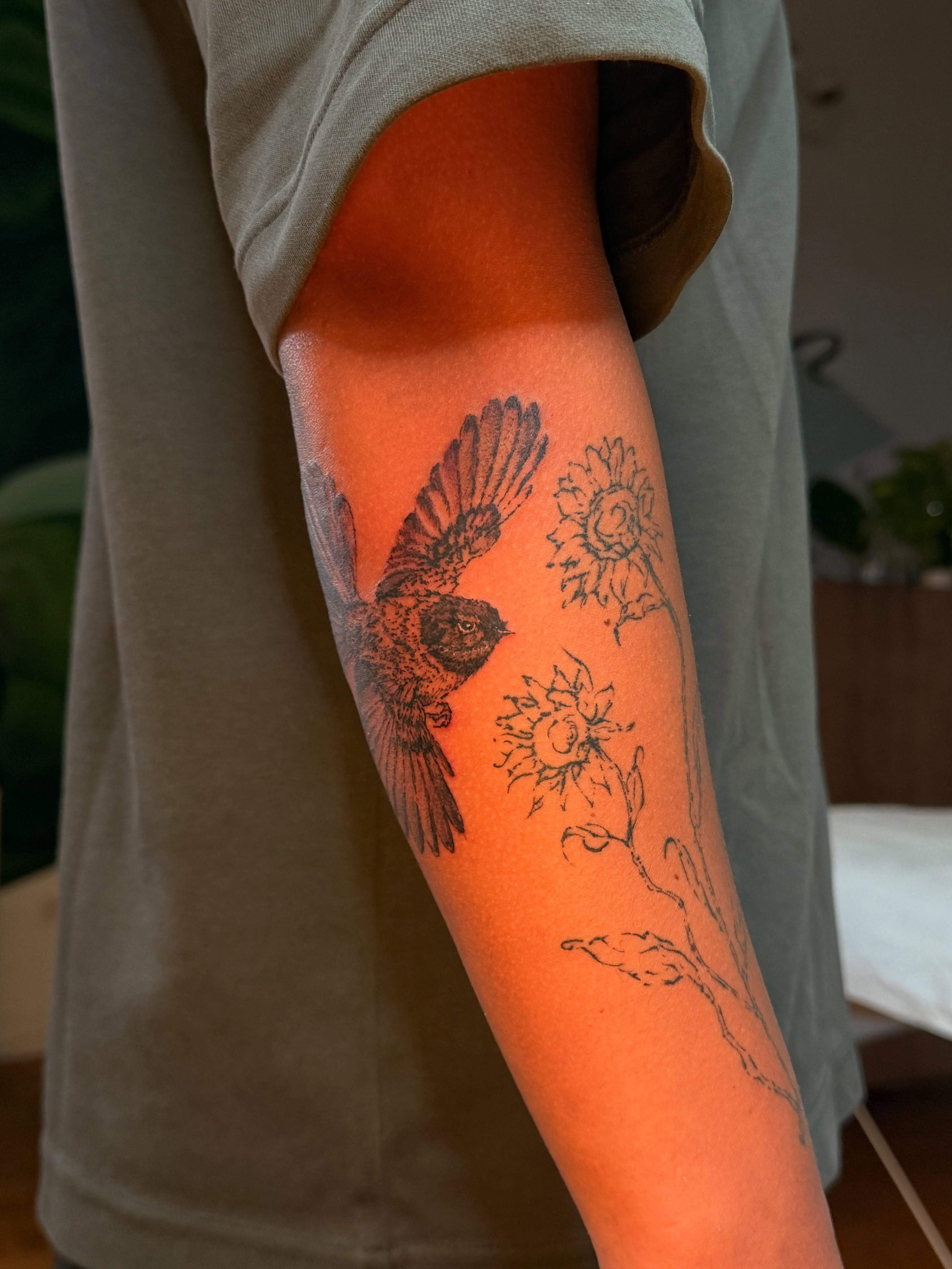 Bird and sunflowers black and grey tattoo on the forearm by Babymaxy Inks Llc