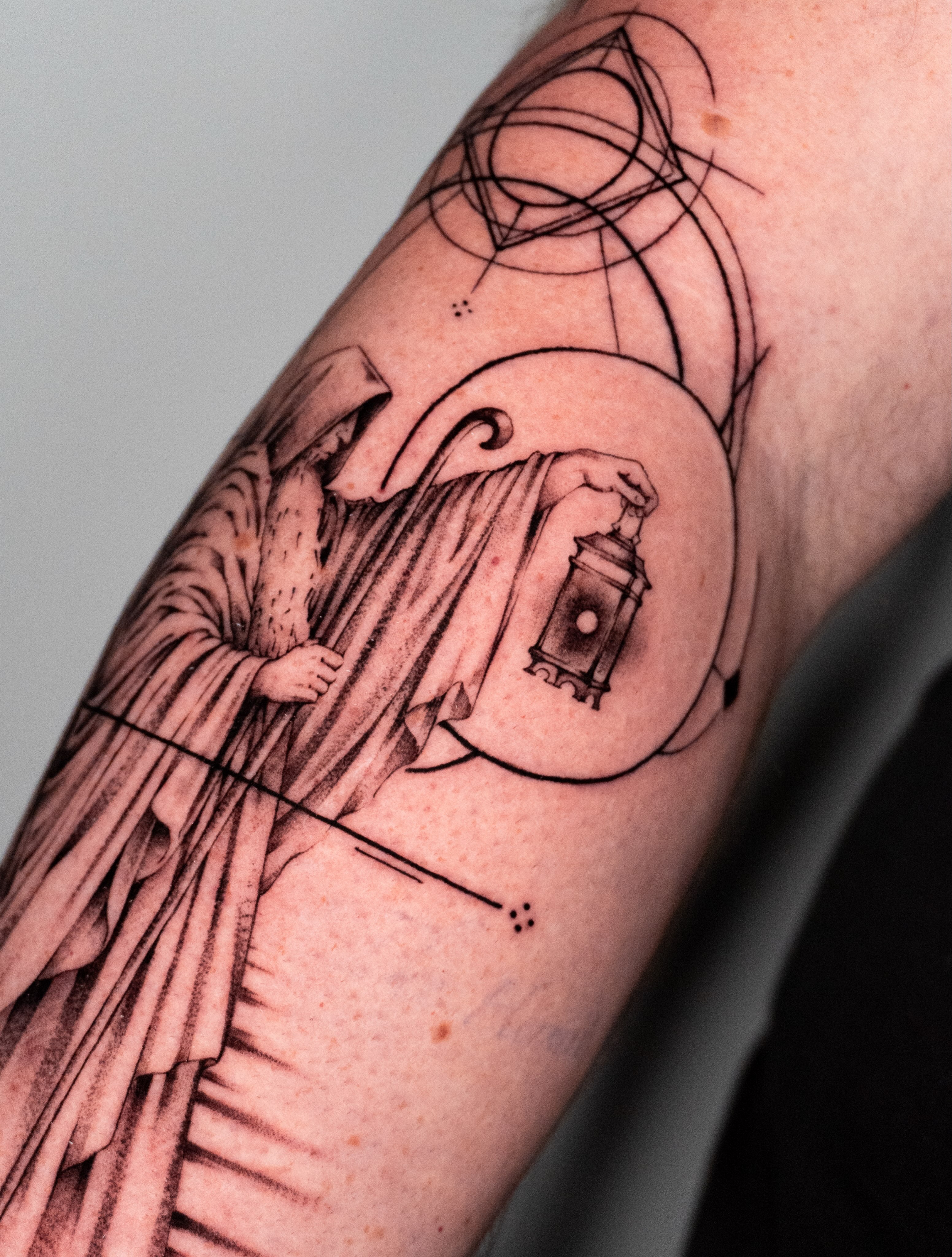 Religious scene realism tattoo on the forearm by Moi Rivas, Salt Lake City, Utah