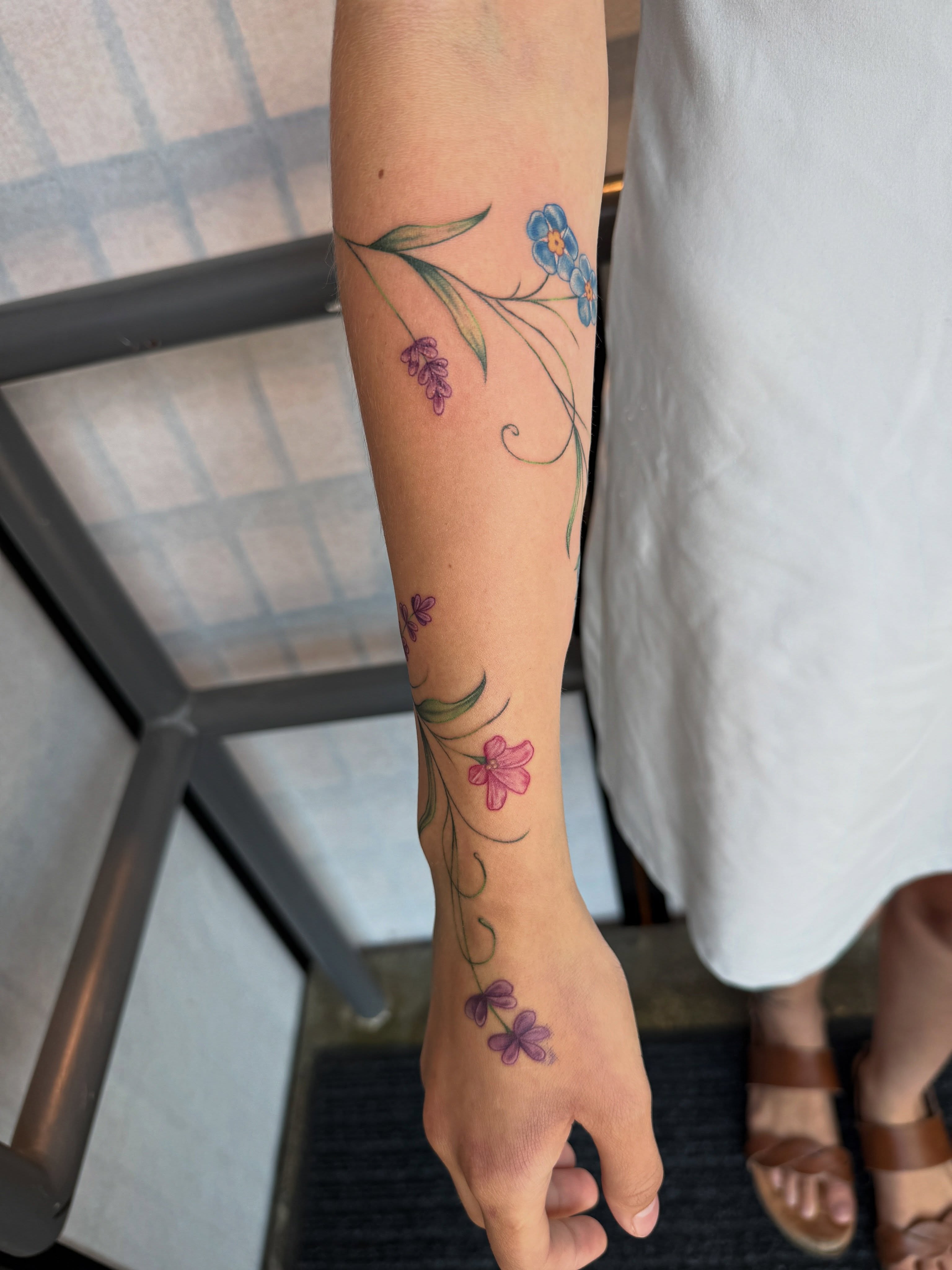Floral arrangement watercolor tattoo on the forearm by ✨Syreena✨