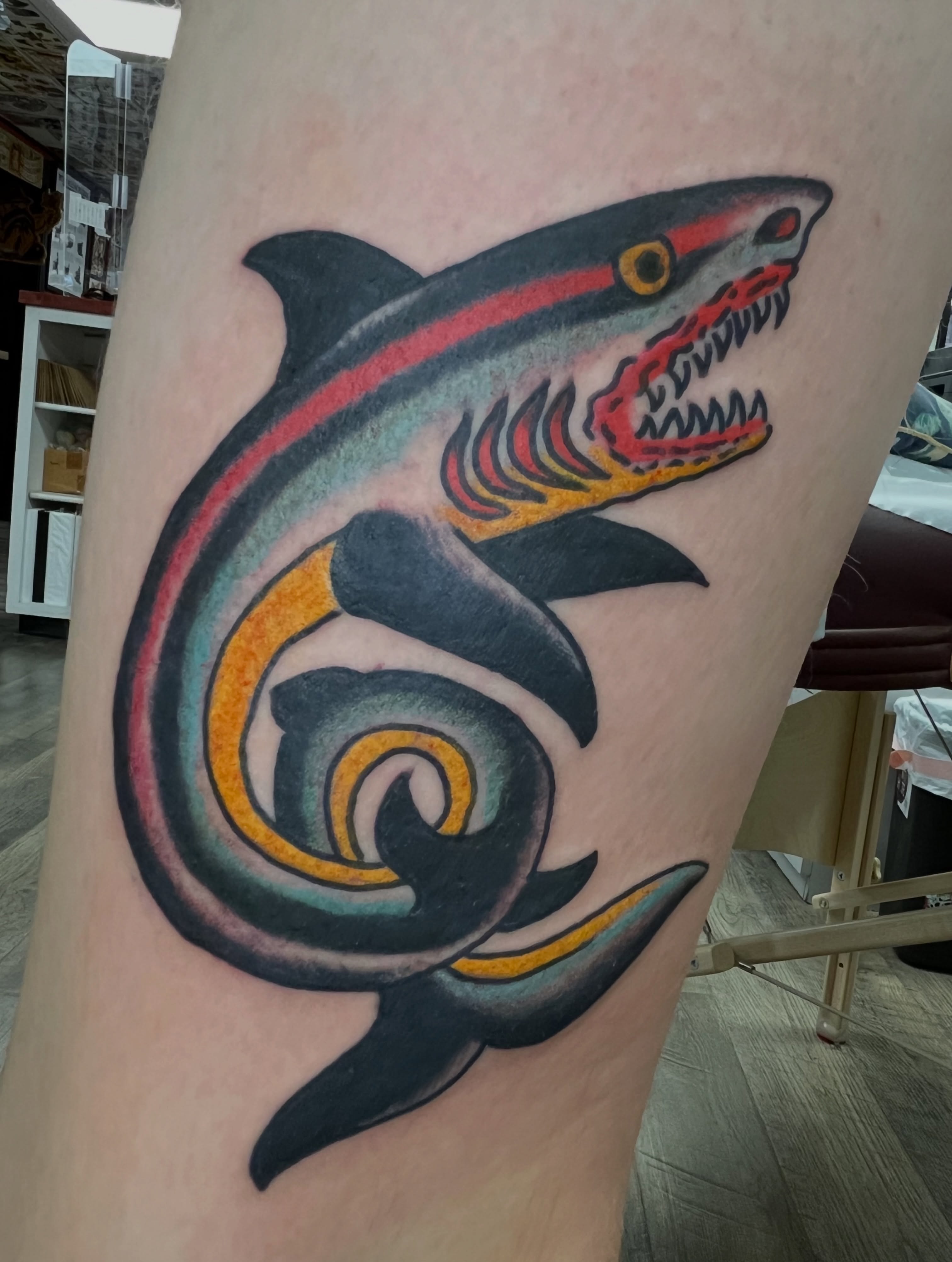 Shark American traditional tattoo on the thigh by Steve Tiberi