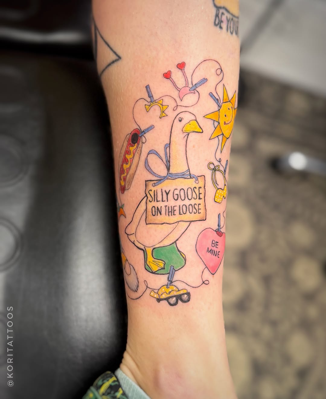 Silly goose illustrative tattoo on the forearm by Kori Millhimes