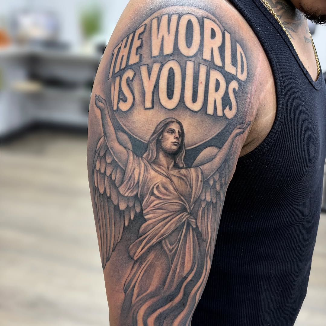 Angel with wings realism tattoo on the upper arm by Dallas Tattoo Artist