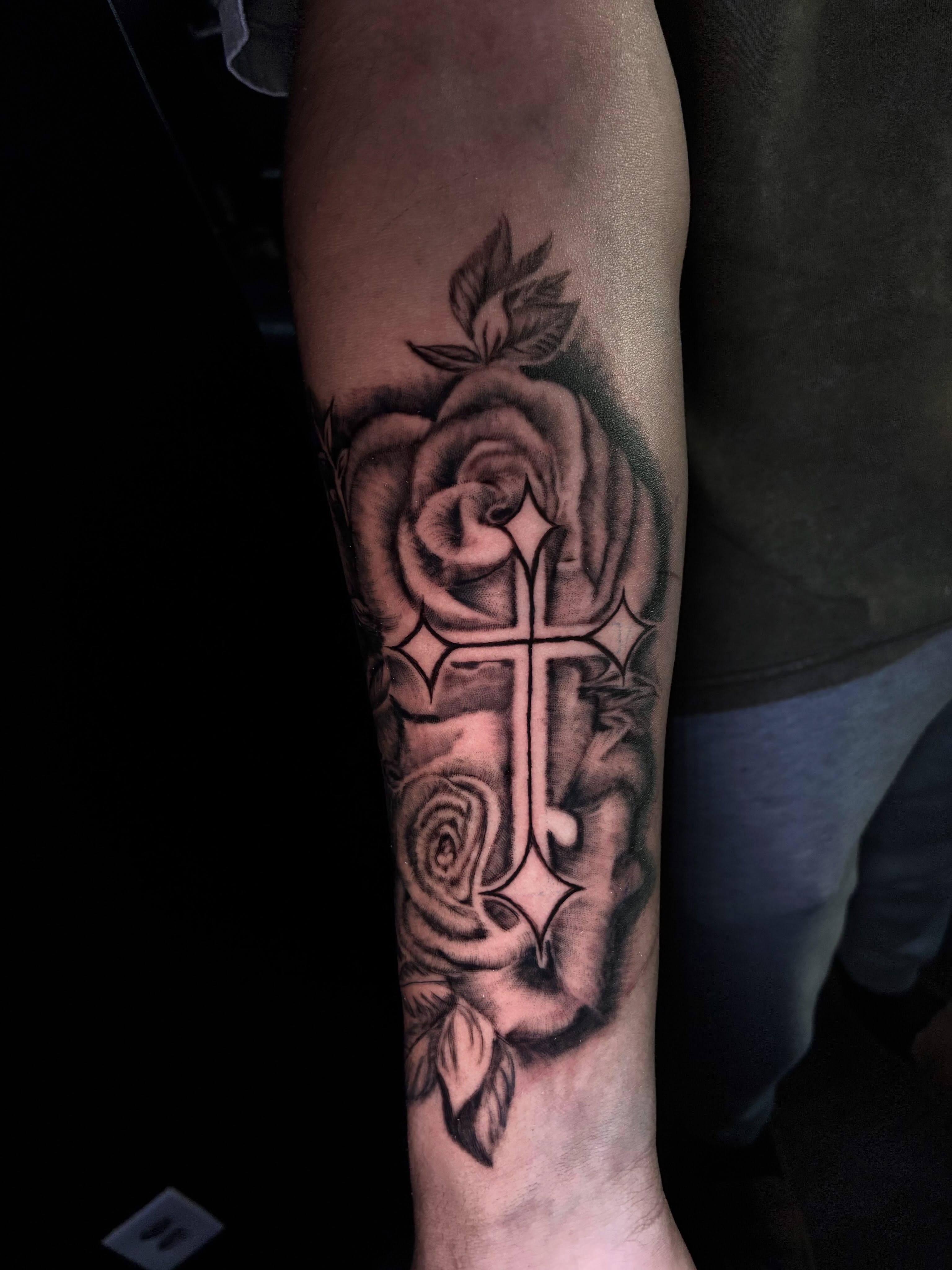 Cross and roses black and grey tattoo on the forearm by Ink’d by Reina 🖤, Colorado Springs, Colorado