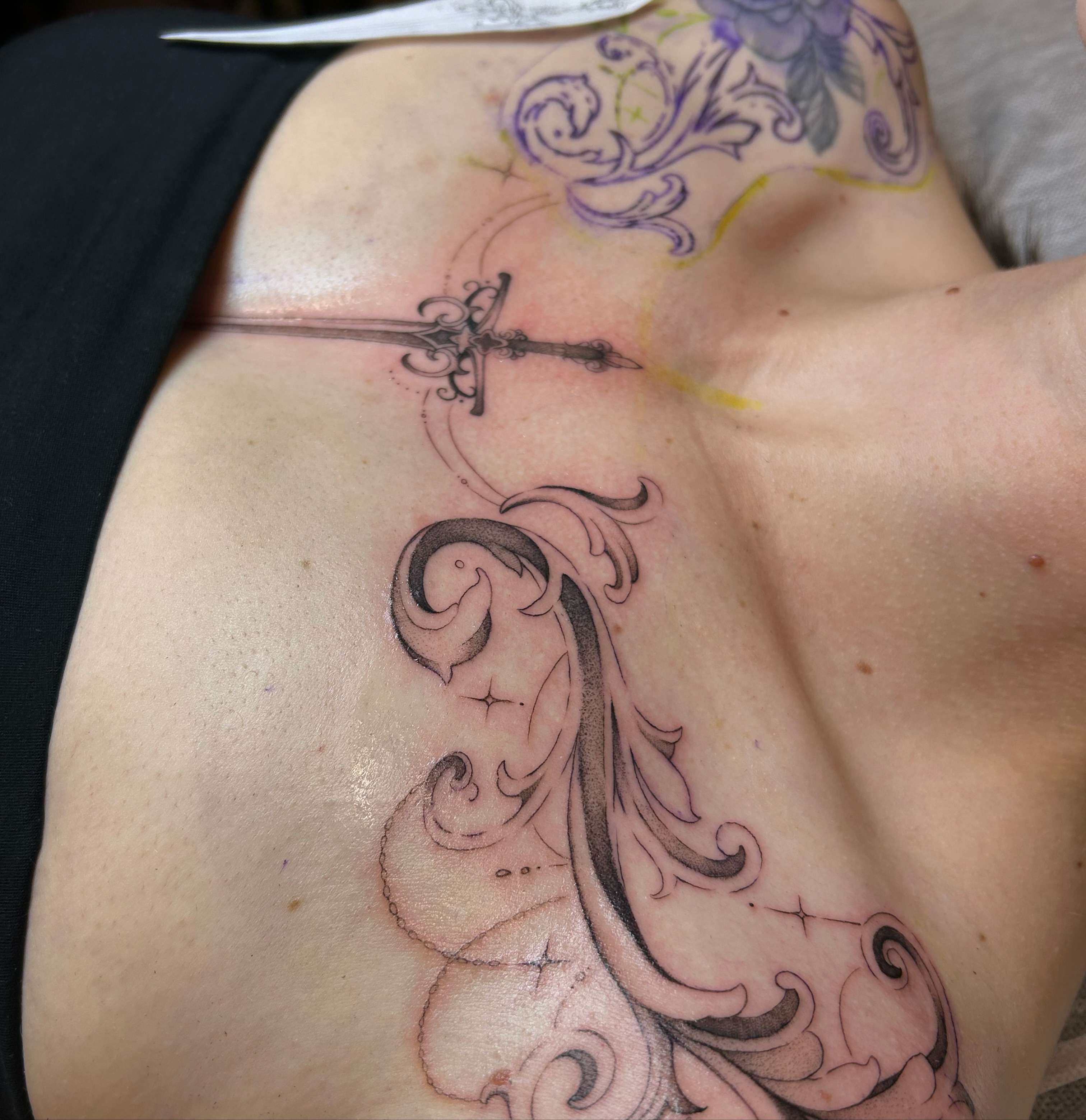 Cross and swirls black and grey tattoo on the chest by alyssa jade ⭐️