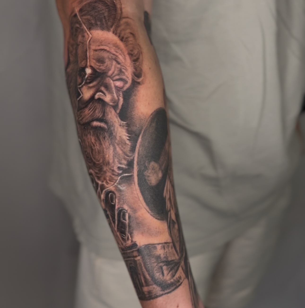 Bearded man realism tattoo on the forearm by Elmer Lethco