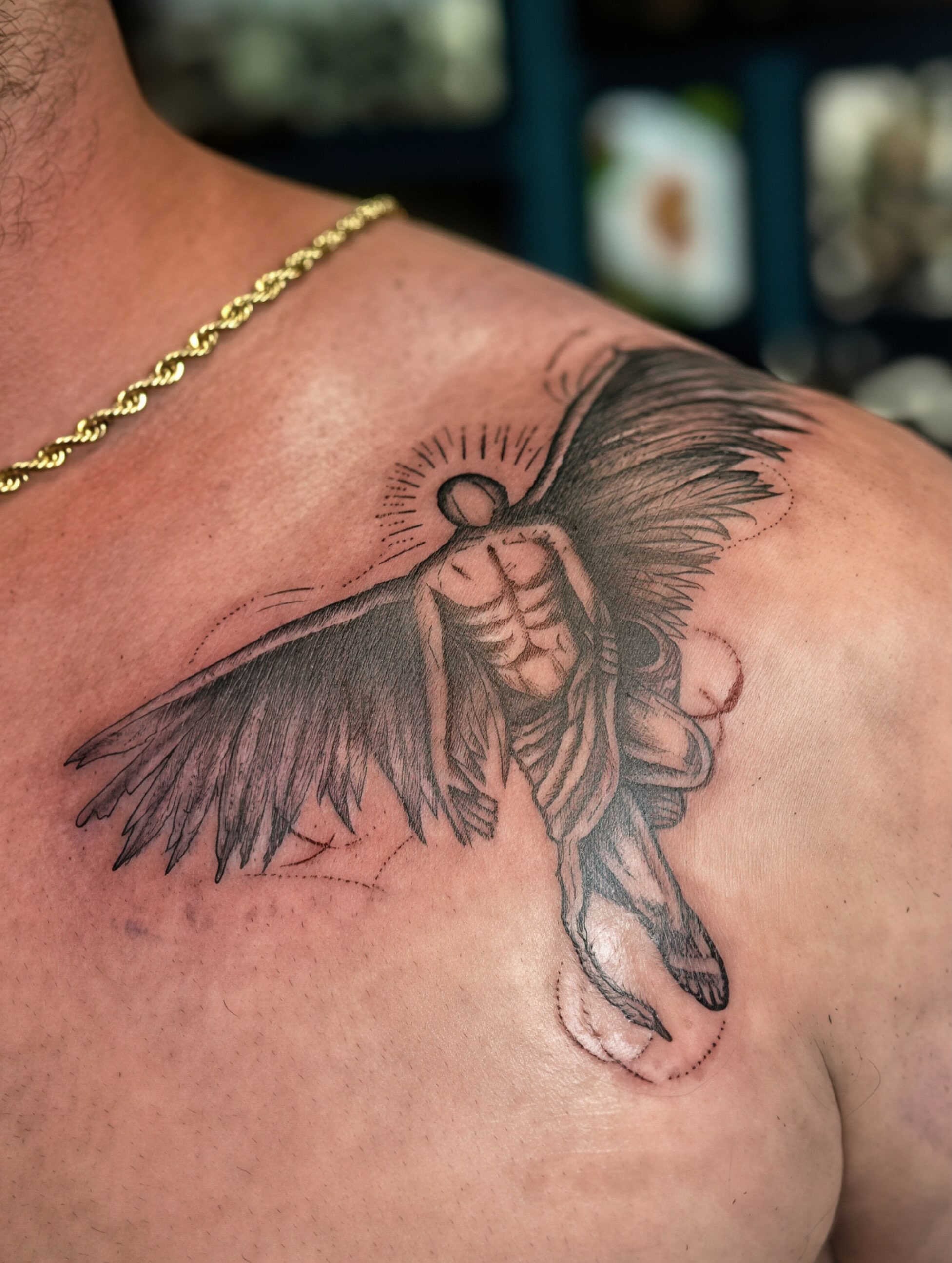 Angelic figure black and grey tattoo on the shoulder by Mikaila Jean