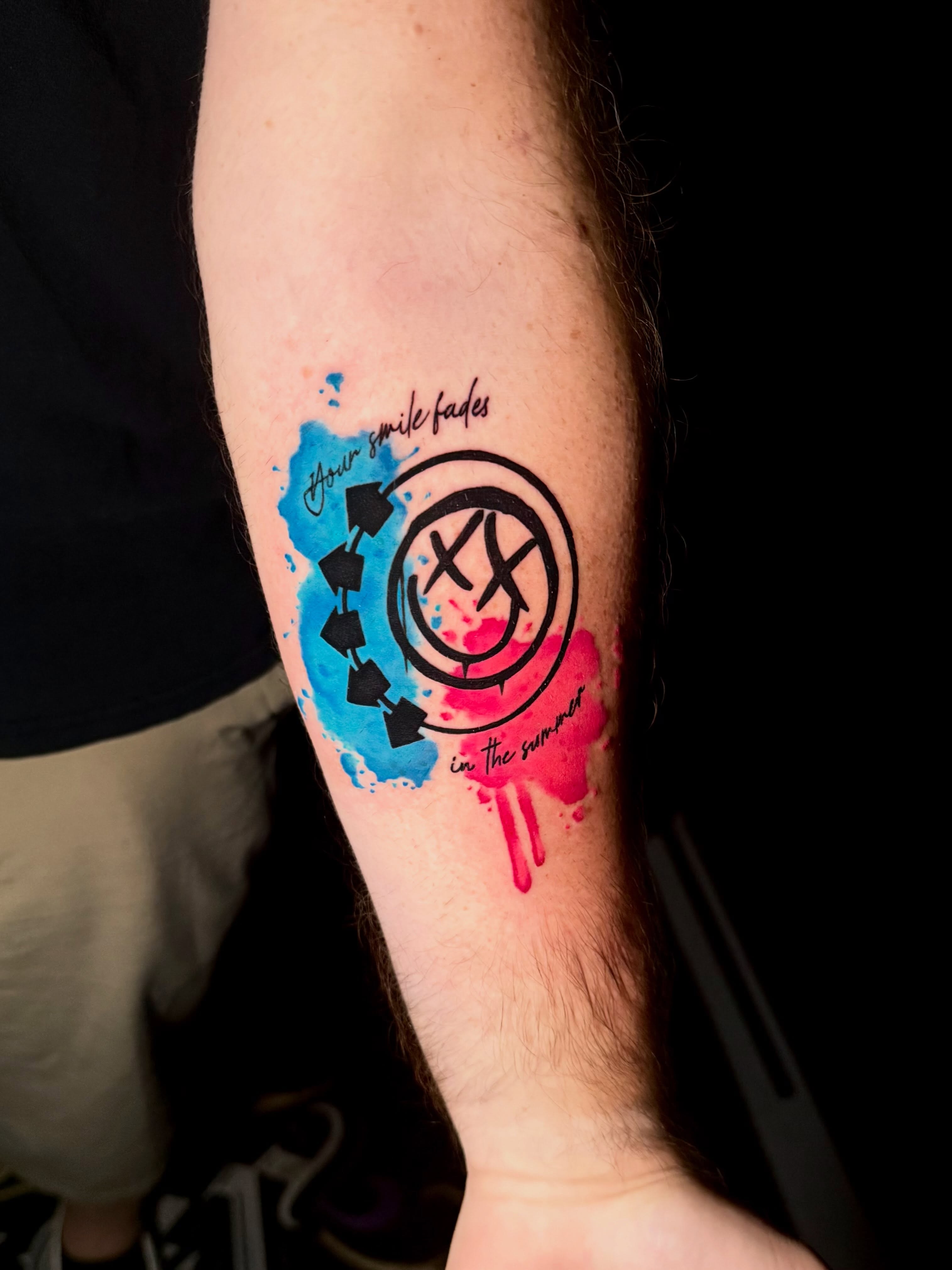 Smile fade watercolor tattoo on the forearm by Taylor Kay 🌿