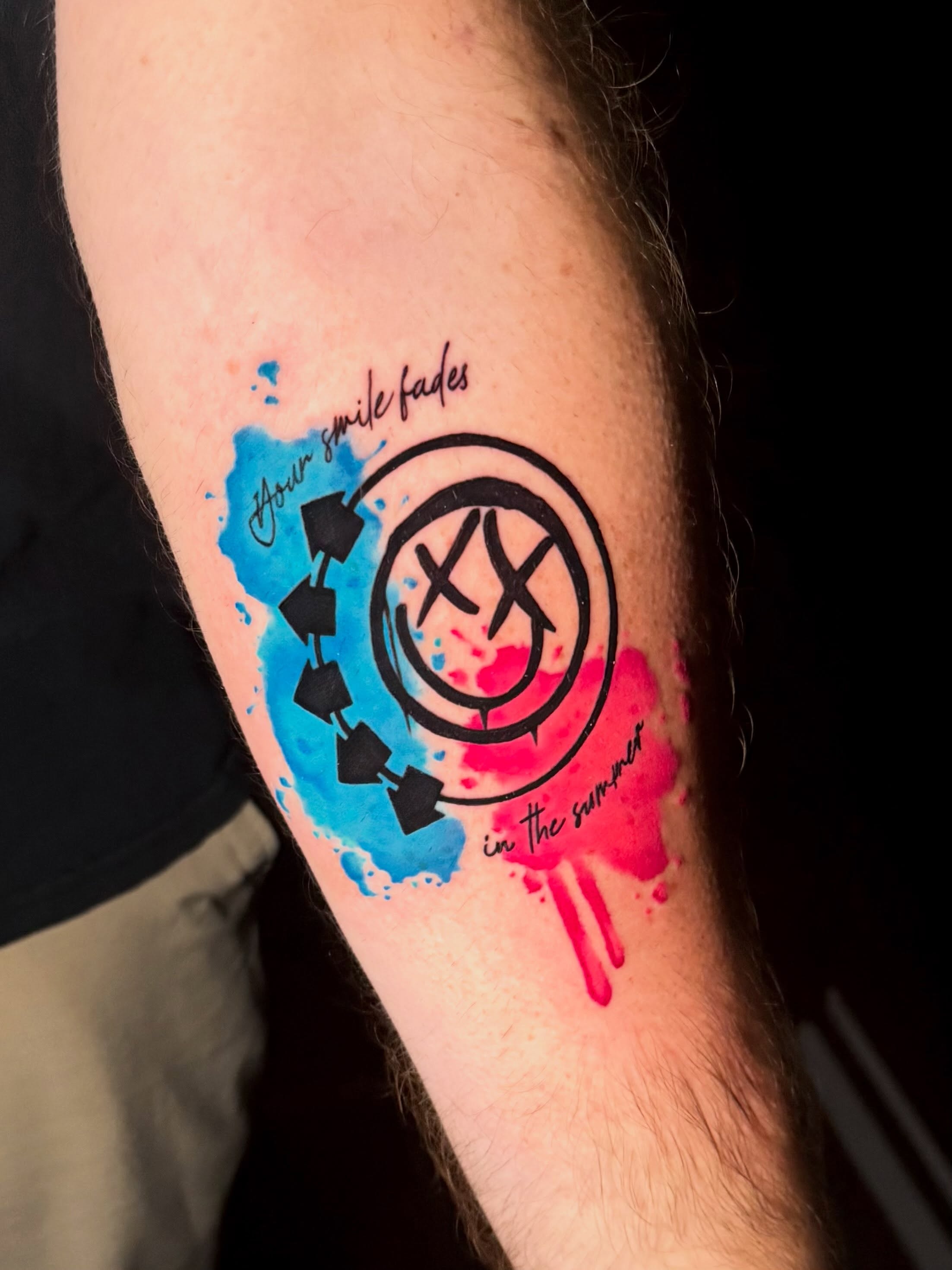 Smile fading watercolor tattoo on the forearm by Taylor Kay 🌿