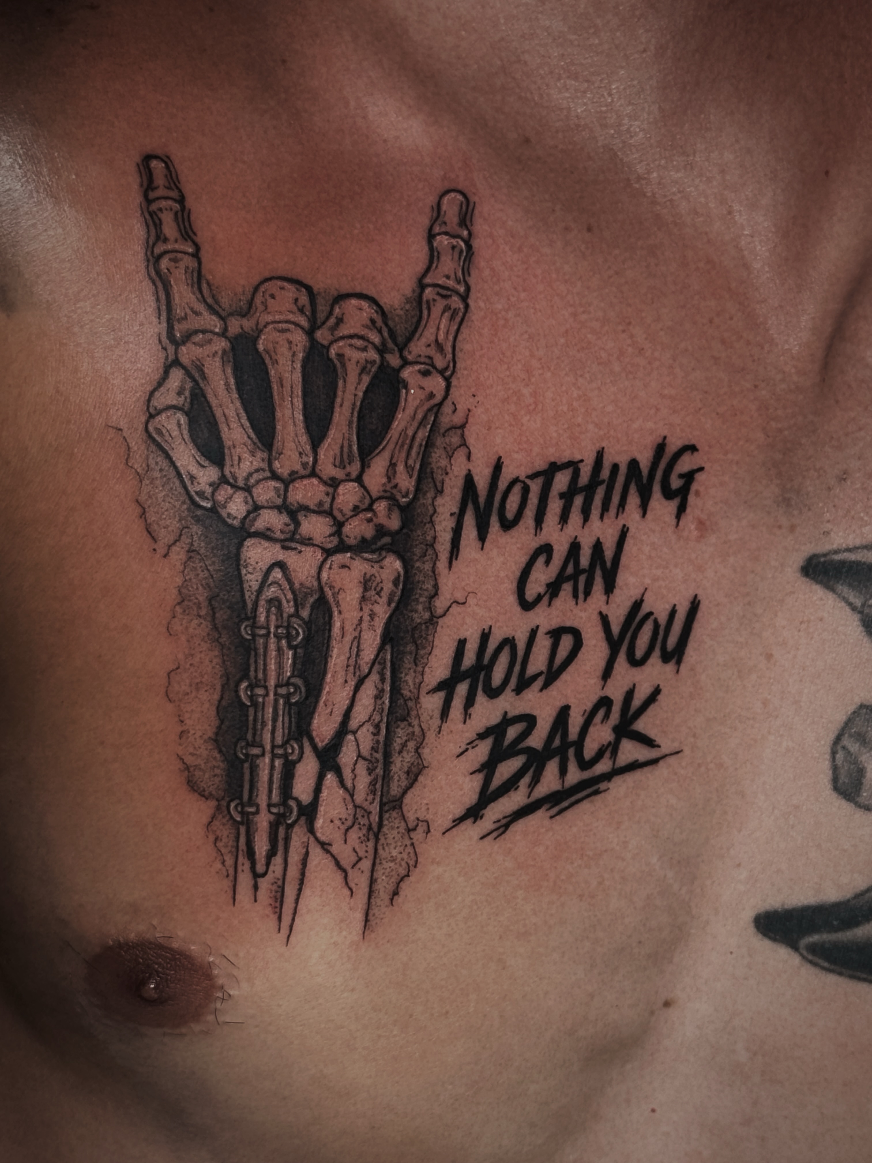 Skeleton hand black and grey tattoo on the chest by Kaylee Castleton, Tooele, Utah