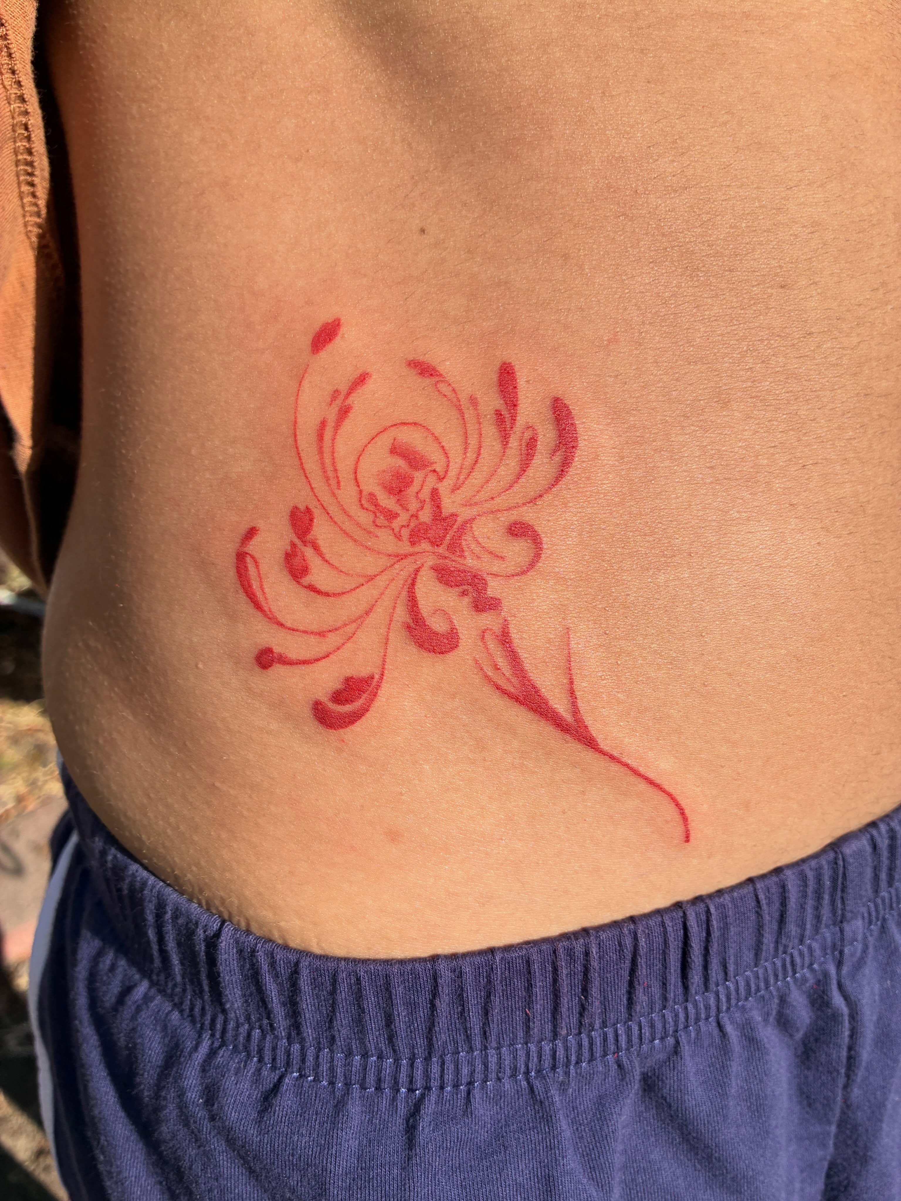 Floral design ornamental tattoo on the torso by Xin.H