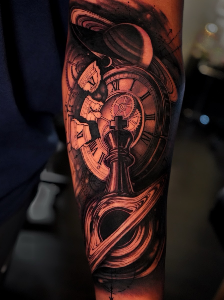 Clock and gears realism tattoo on the forearm by Haley Corinne