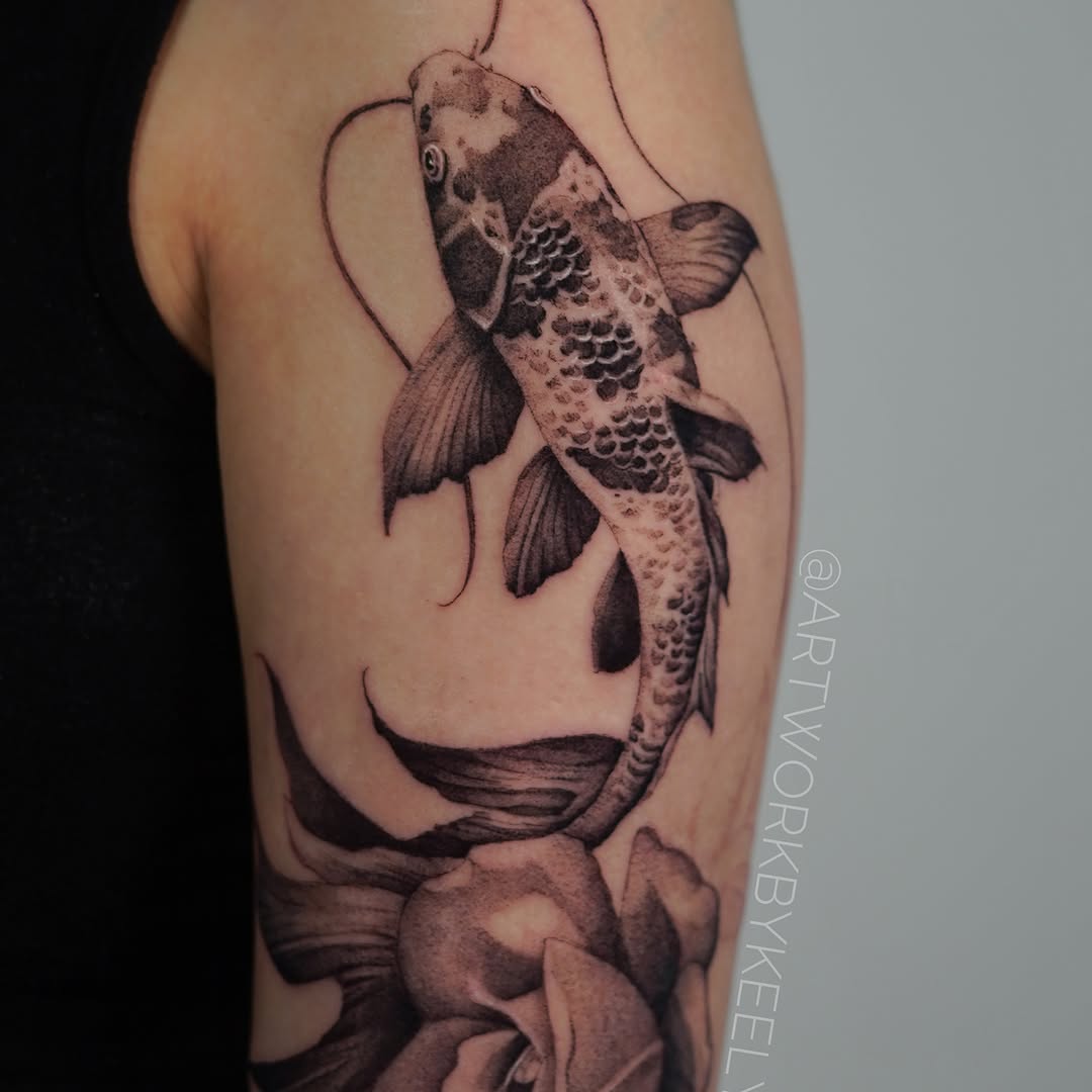 Koi fish realism tattoo on the forearm by Keely Thompson