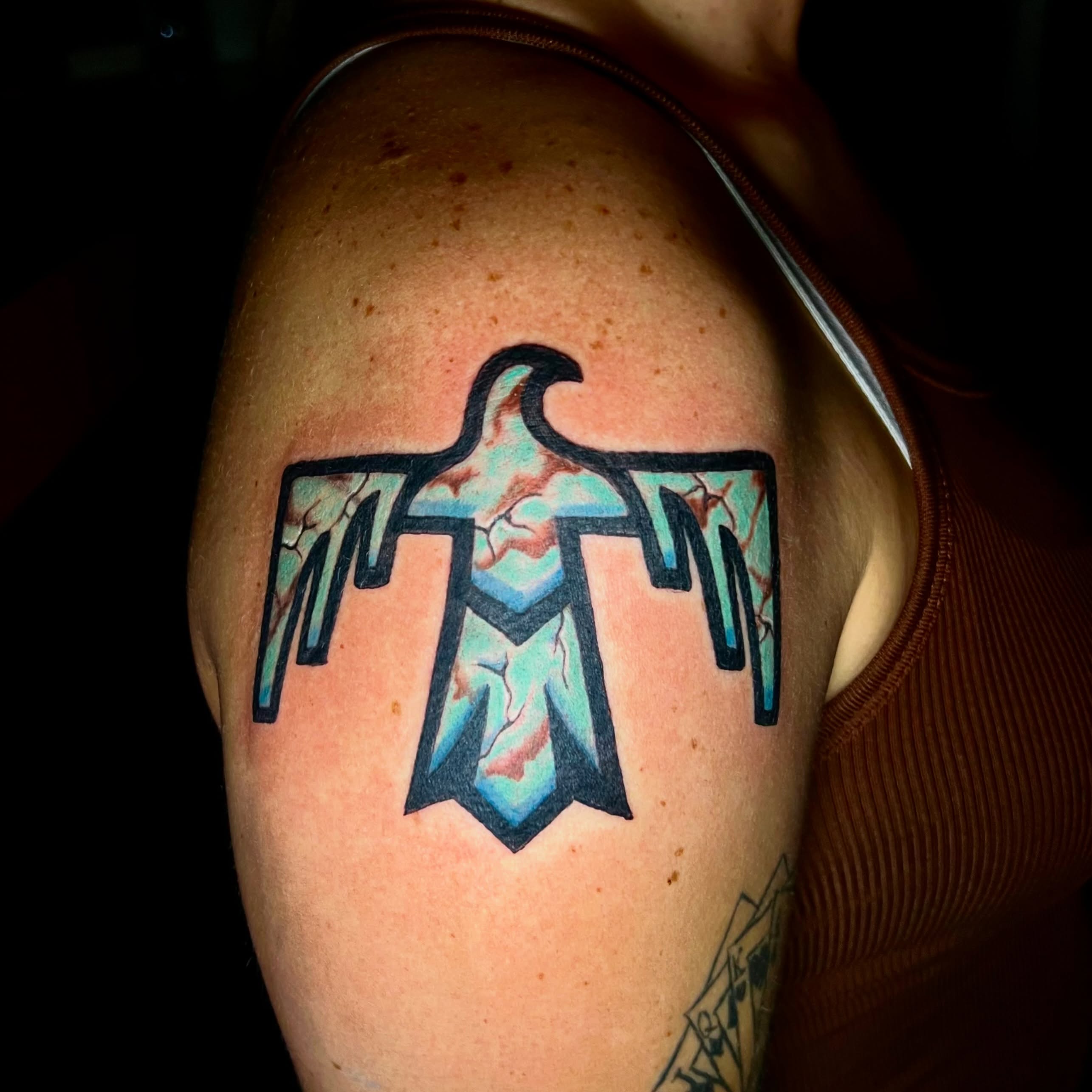 Ice bird geometric tattoo on the shoulder by Deacon Moser