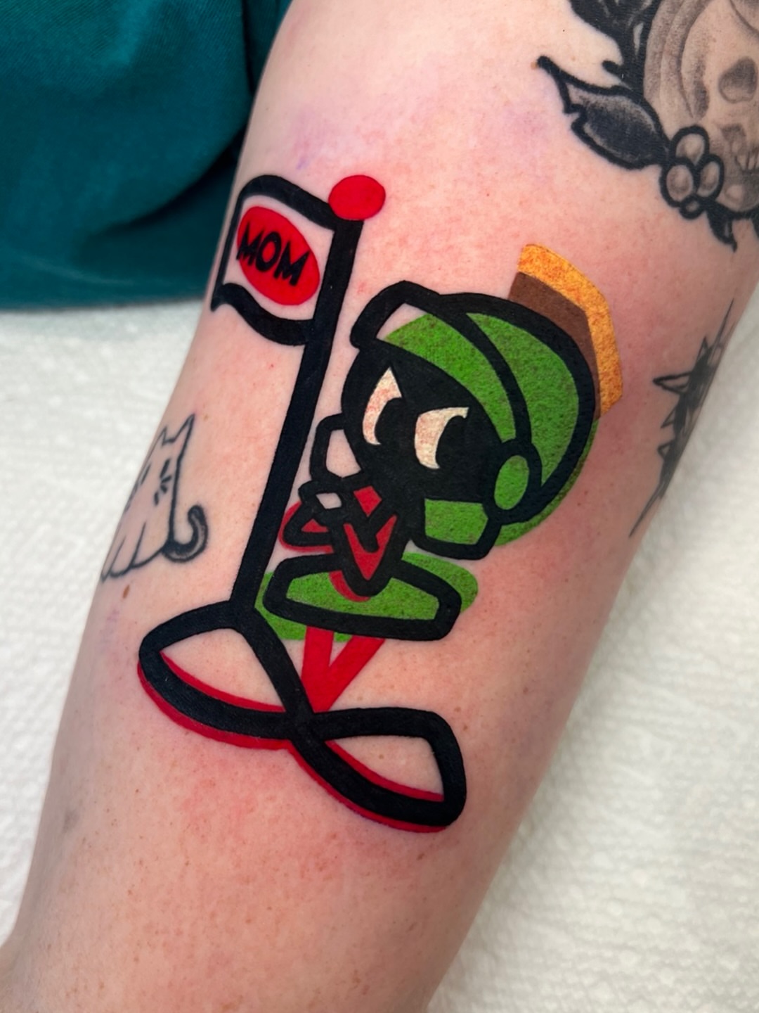 Mario character new school tattoo on the forearm by Tattoo Artist