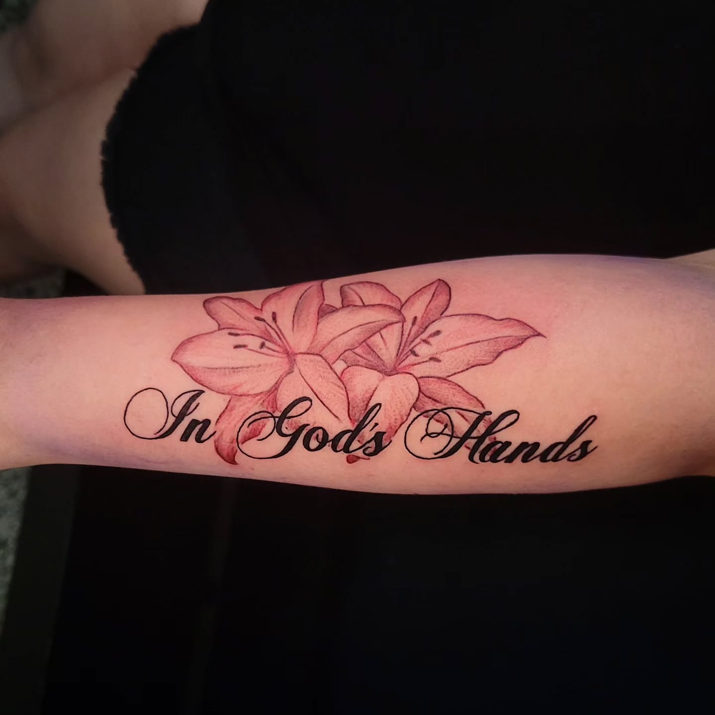 Lilies realism tattoo on the forearm by Sarah Alba